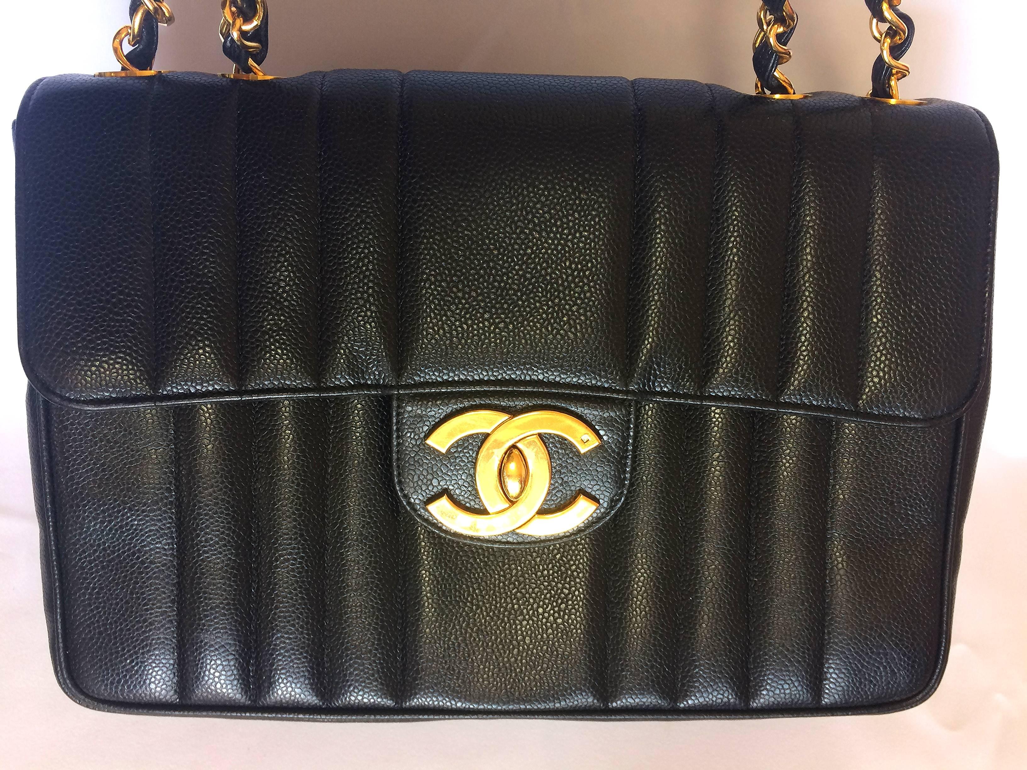 1990s. Vintage CHANEL black 2.55 jumbo caviar leather large shoulder bag with golden CC Vertical stitch. Classic caviar leather.

Perfect life-time classic bag for your life....

Introducing one of the most popular and classic masterpiece bags from