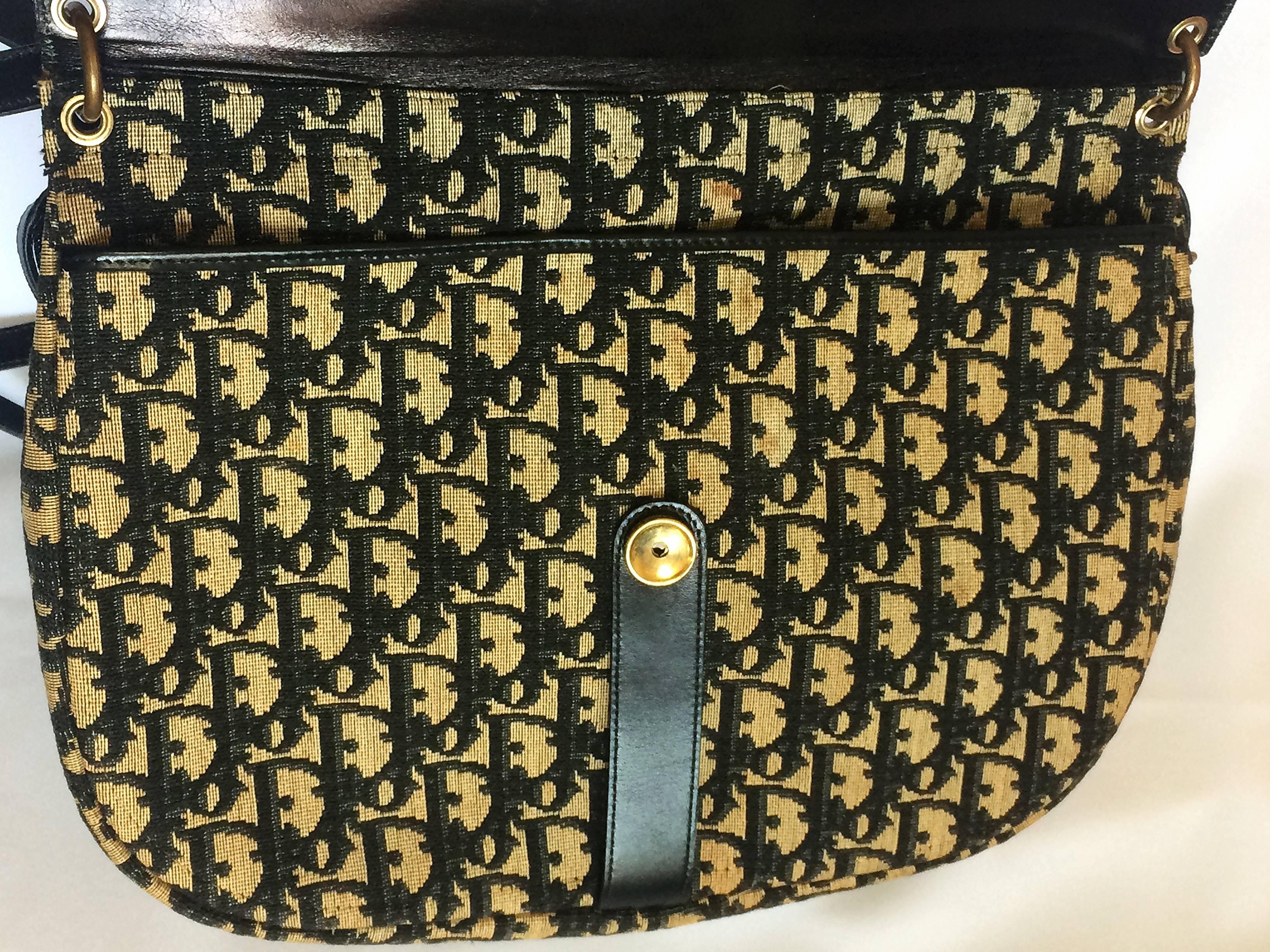 1980s. vintage Christian Dior navy leather and trotter jacquard shoulder bag with gold tone logo closure. Classic bag from Modele Exclusif.

So chic and soooo vintage Dior!! Would fit with any outfits and season! 
This is a Christian Dior vintage