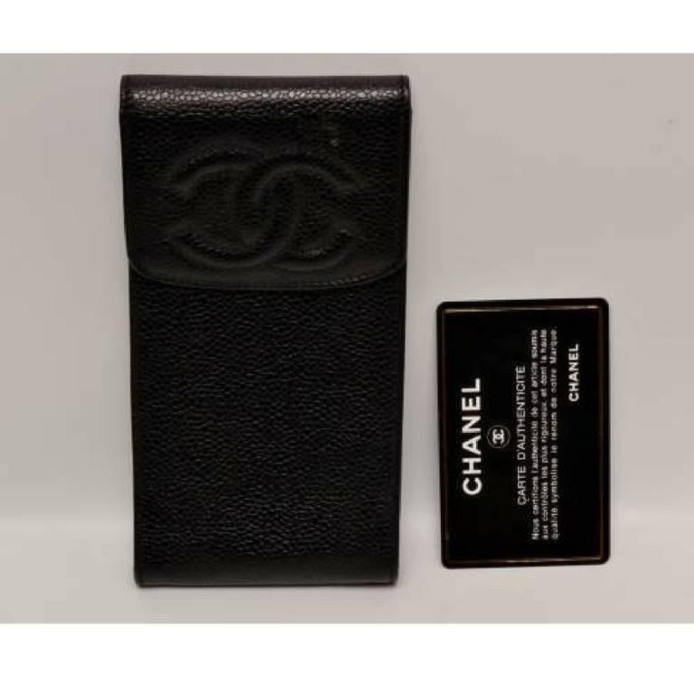 1990s. Vintage CHANEL black caviar leather mini pouch for iPhone, cigarettes, coins, card, cosmetic mini case with CC mark. Gift for unisex.

This is a CHANEL vintage pouch case in classic black caviarskin from the 90s.
The CC stich mark is at