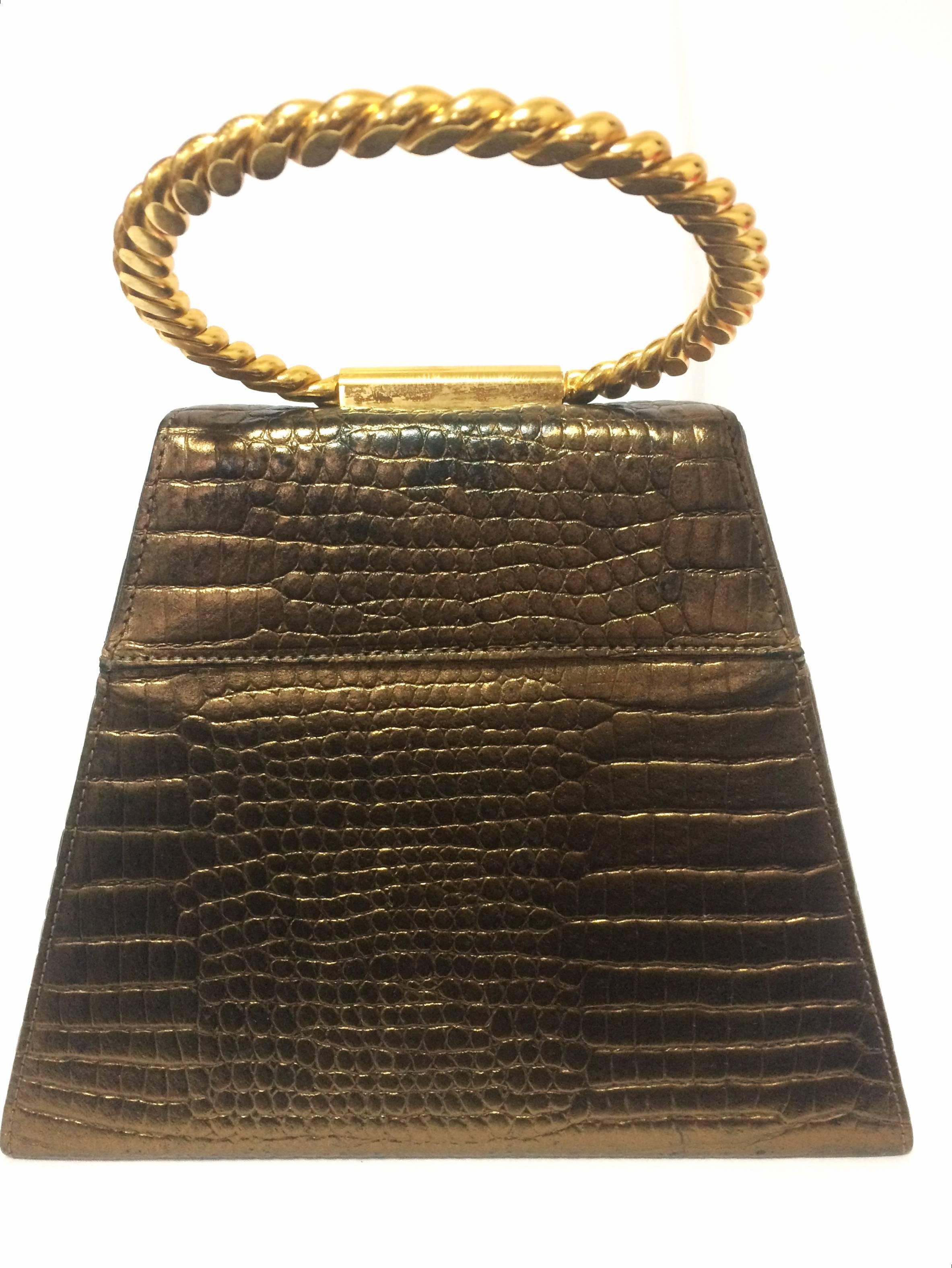 1990s. Vintage Charles Jourdan bronze gold croc embossed leather triangle shape vanity bag with chain hoop handle.

Introducing another gorgeous piece for party use from Charles Jourdan back in the 90's. 
Bronze gold foil finish croc-embossed
