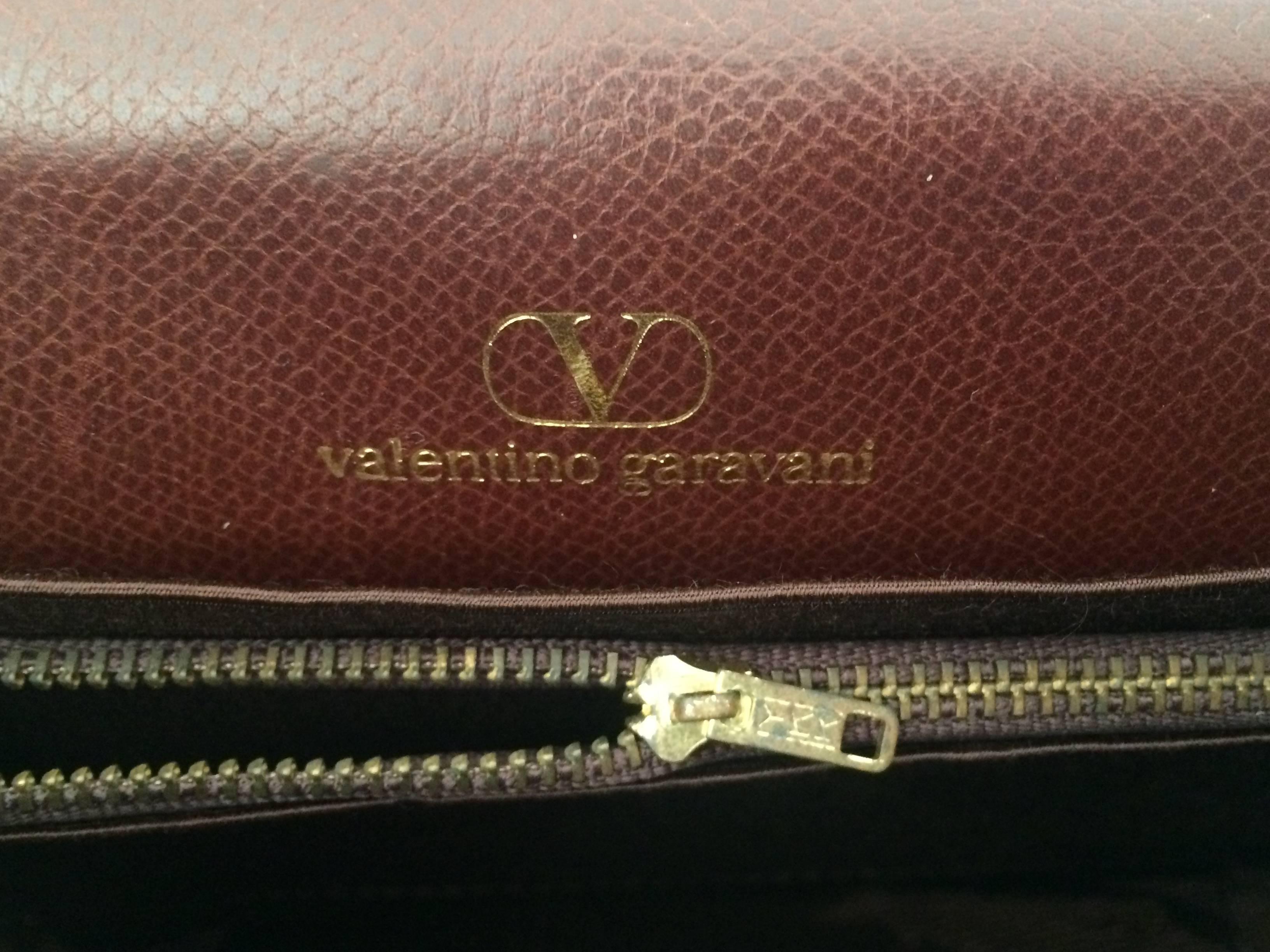 Vintage Valentino Garavani dark brown leather shoulder bag with tassel charm. 1