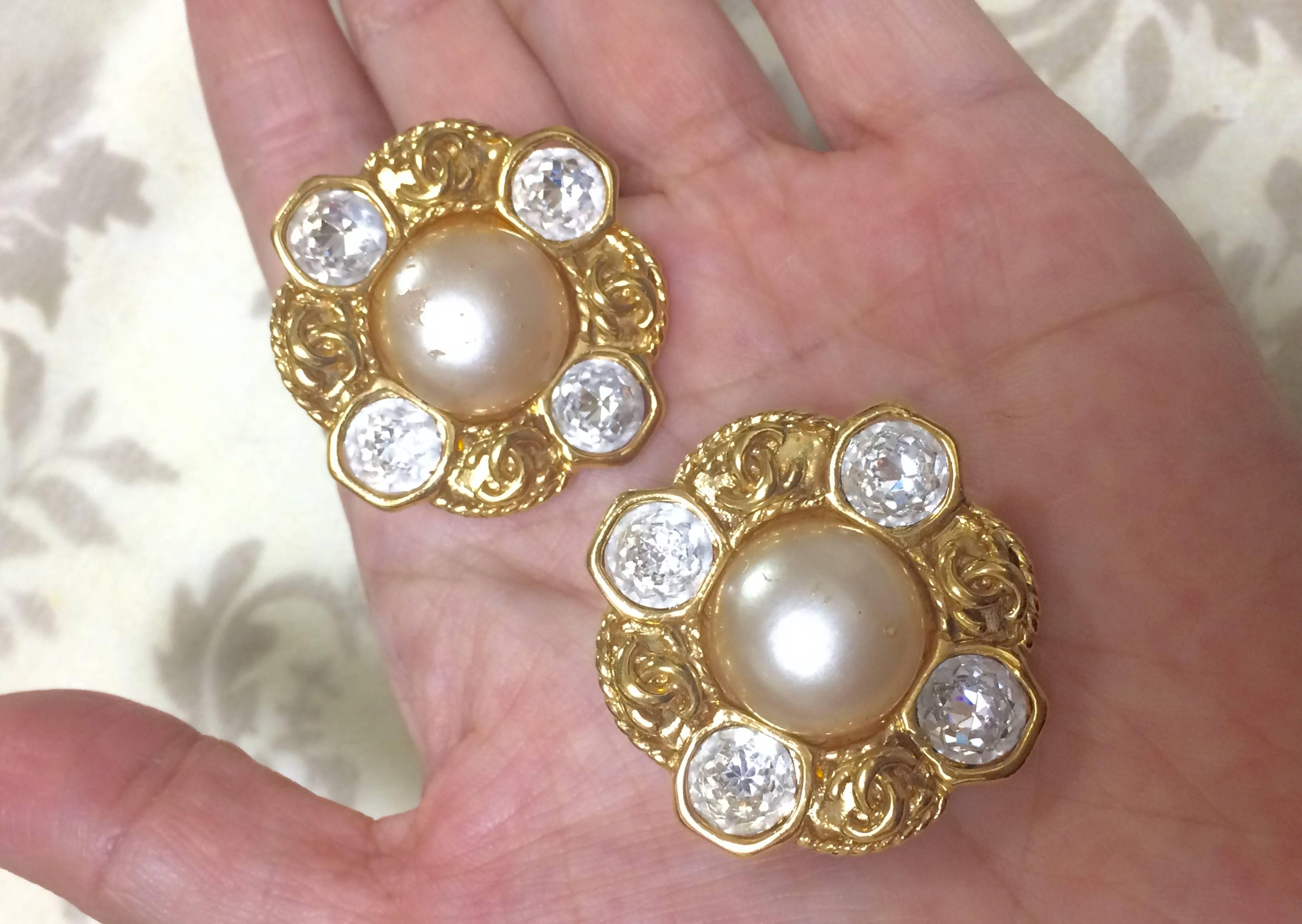Vintage CHANEL gold tone earrings with a faux pearl, Swarovski crystal stones For Sale 3