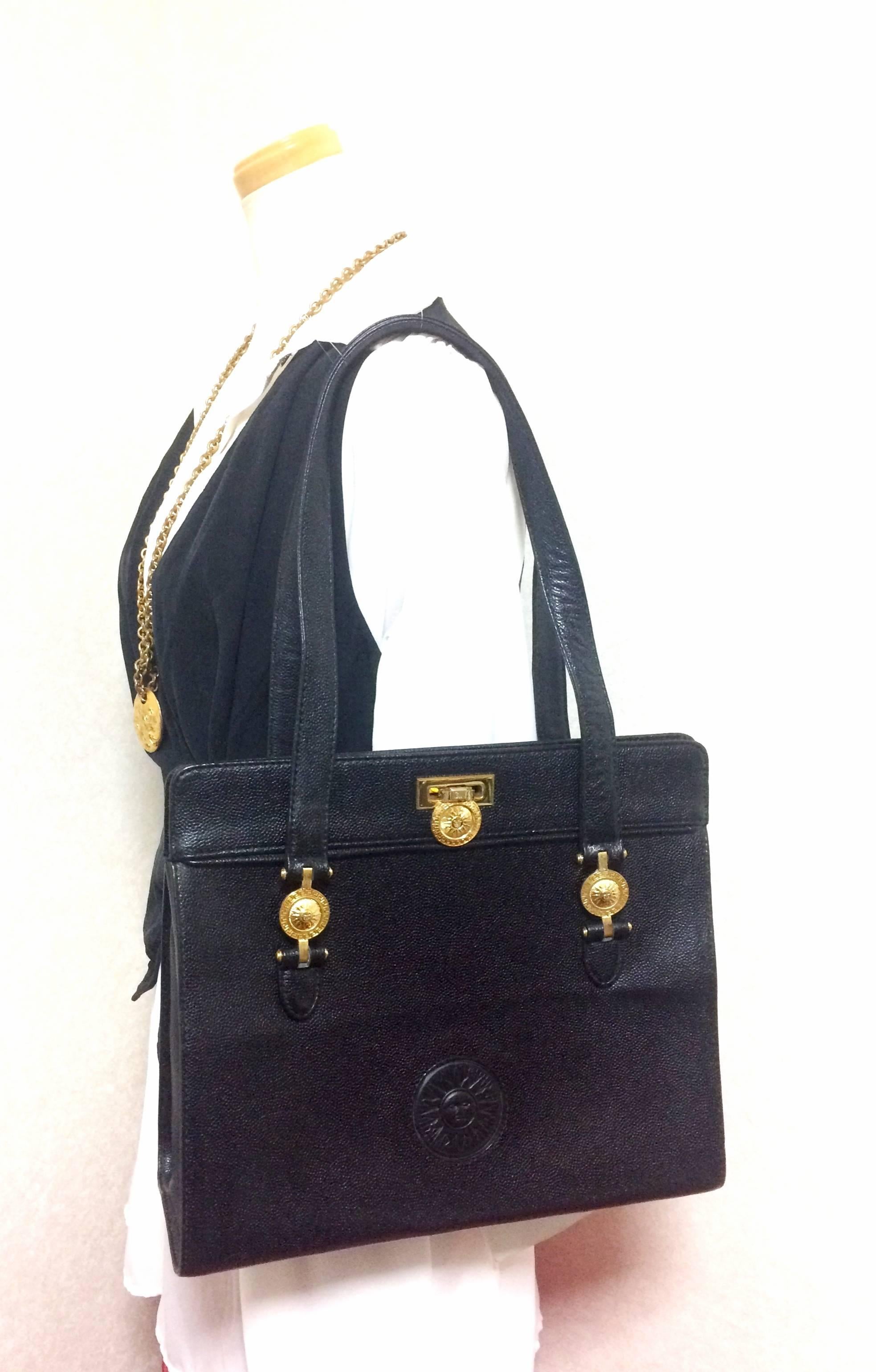 Vintage Gianni Versace black leather tote bag with golden sunburst motifs. For Sale 4