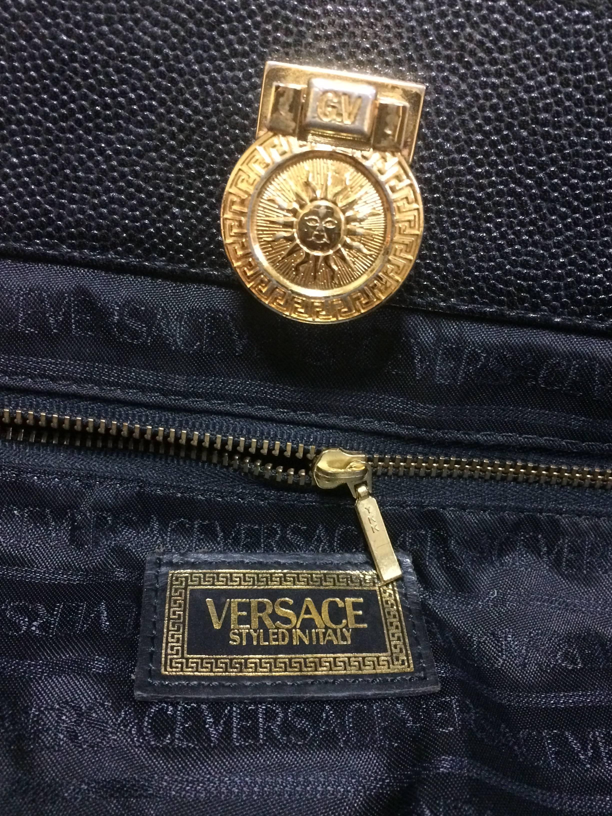 Vintage Gianni Versace black leather tote bag with golden sunburst motifs. For Sale 3