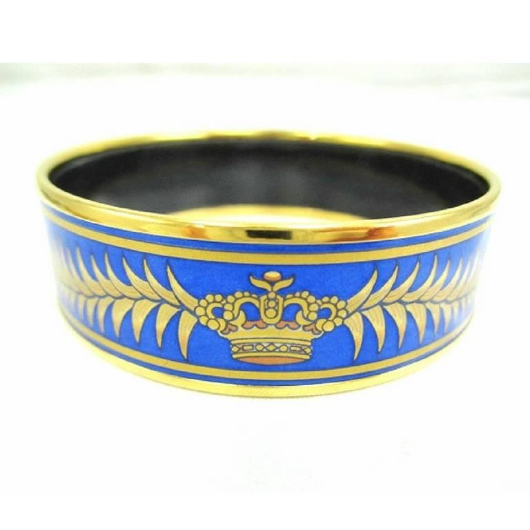 1990s. Vintage Hermes cloisonne enamel golden thick bangle, bracelet  with tiger and crown design in gold and blue. Made in Austria.

Introducing another masterpiece jewelry piece  from HERMES back in the 90's, 
iconic enamel/cloisonne golden bangle