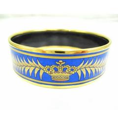 Vintage Hermes cloisonne enamel golden bangle GM with tiger and crown design.