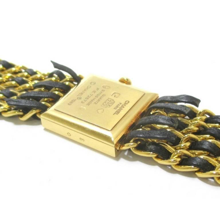 Women's or Men's 80's Vintage CHANEL golden chain and black leather wrist watch. K18 Yellow gold. For Sale