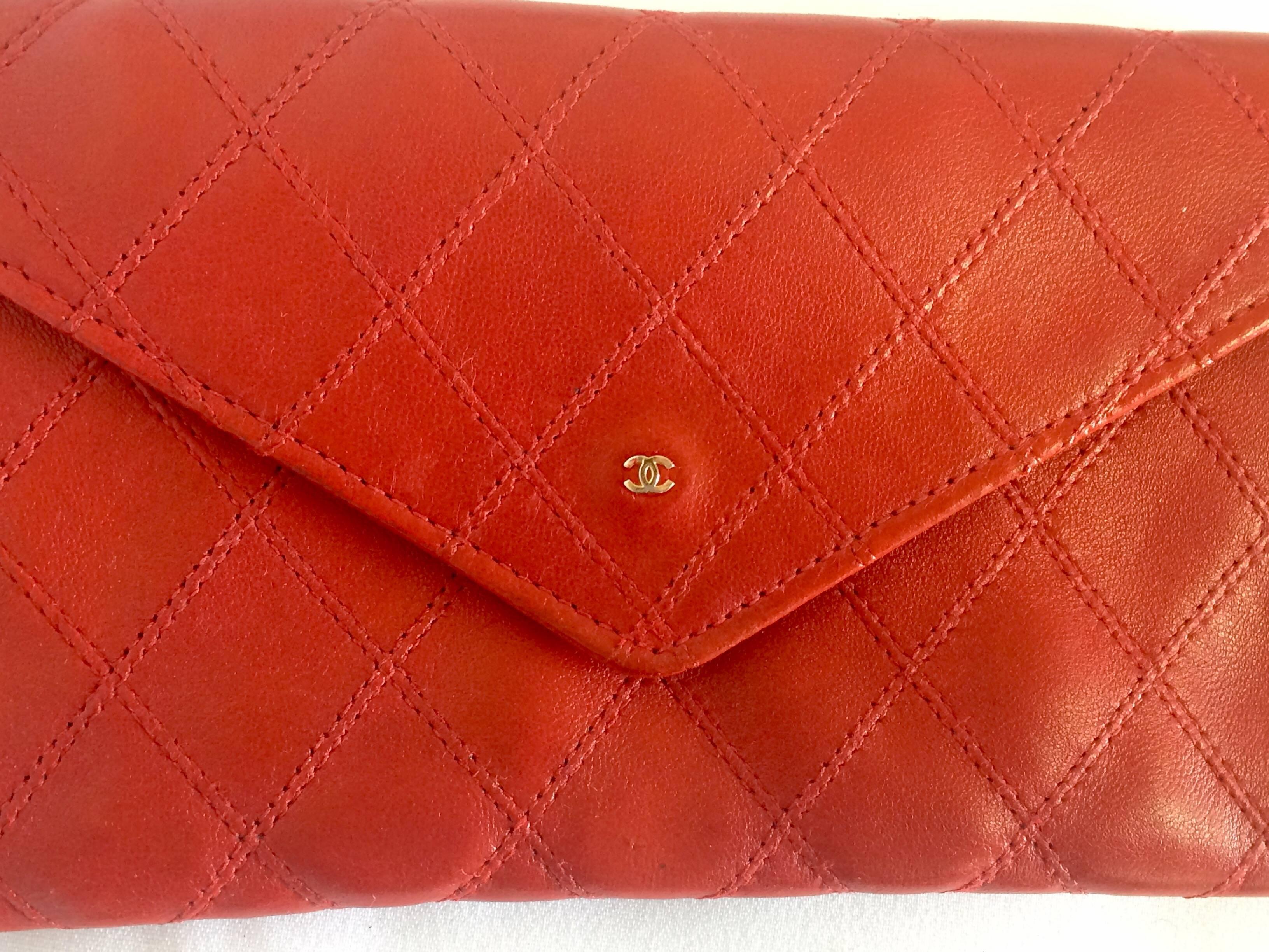 1990s.Vintage CHANEL goatskin bicorole black bill, card, checkbook long wallet pouch purse with silver mini CC motif. Classic wallet.

This is a CHANEL vintage pouch type wallet in red goatskin from early 90's.
Nice color and soft material.
The