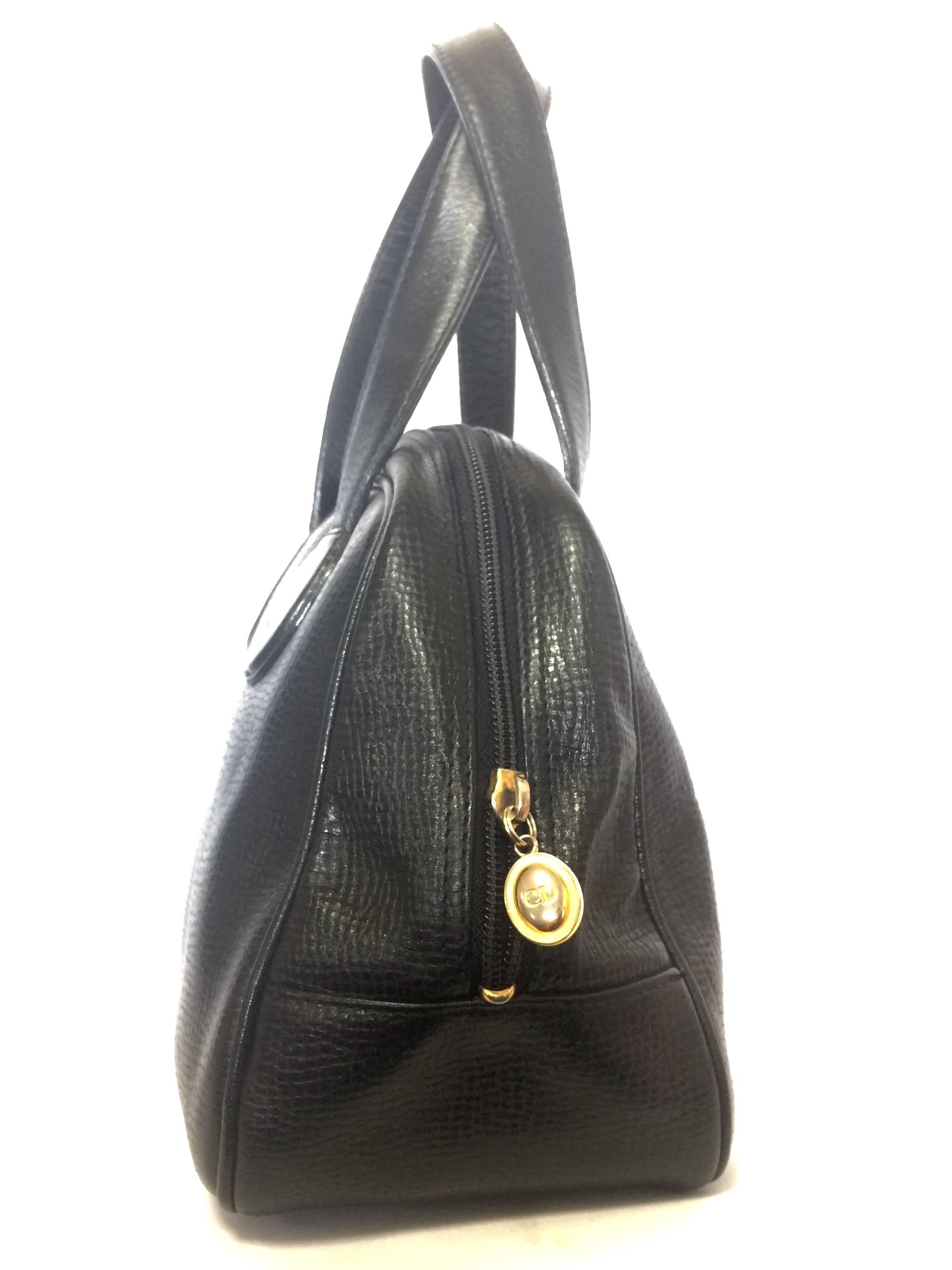 Women's Vintage Christian Dior black leather mini bolide style handbag with logo motif.