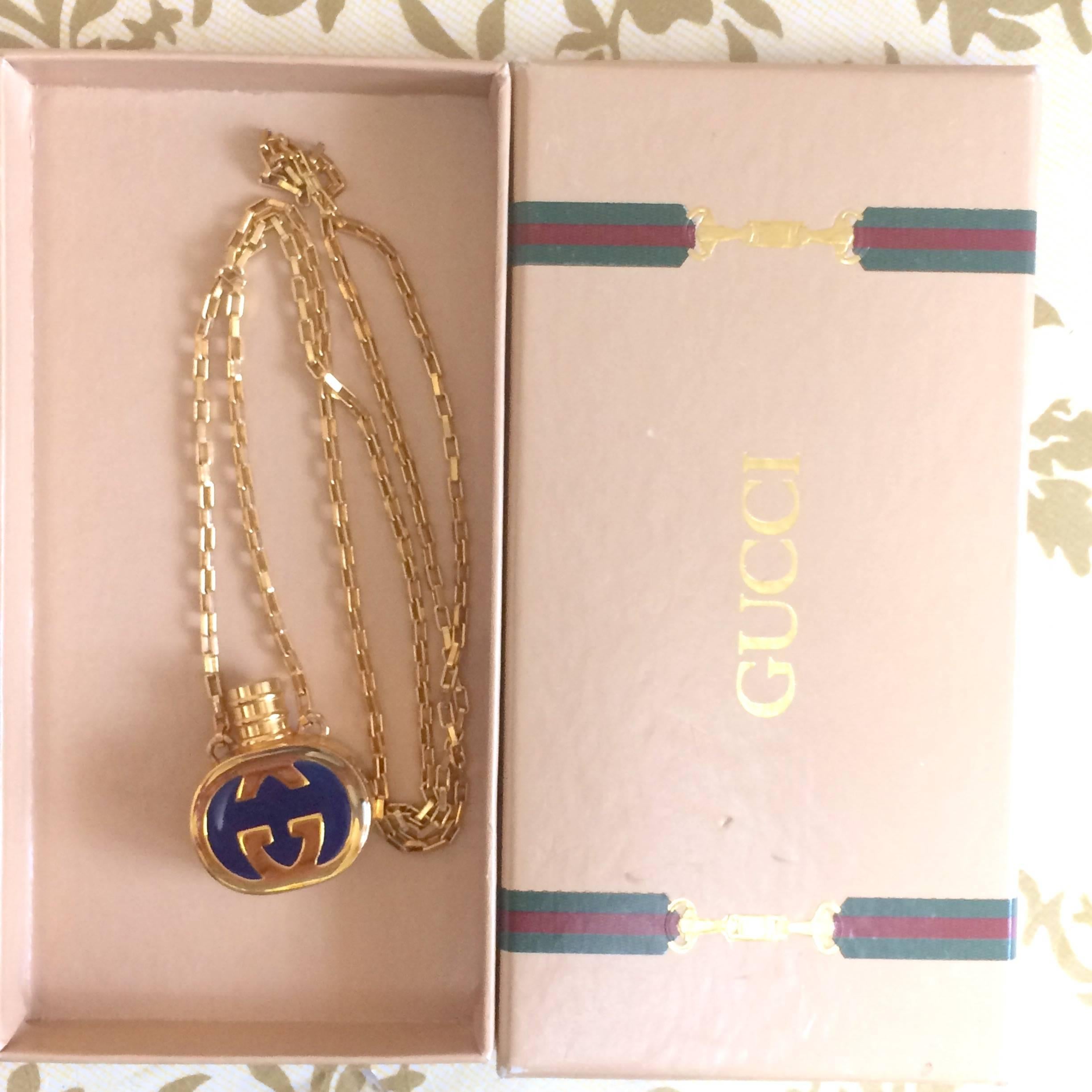 Vintage Gucci gold and navy round shape perfume bottle necklace with logo mark. 2