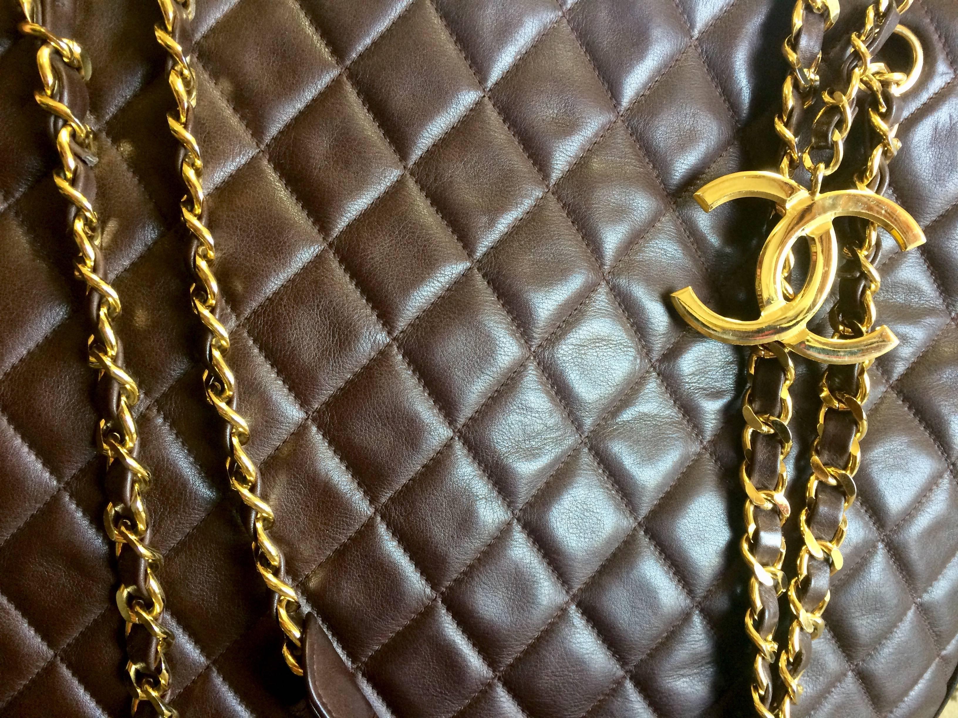 Brown Vintage CHANEL brown lambskin large tote bag with gold tone chains and CC charm. For Sale