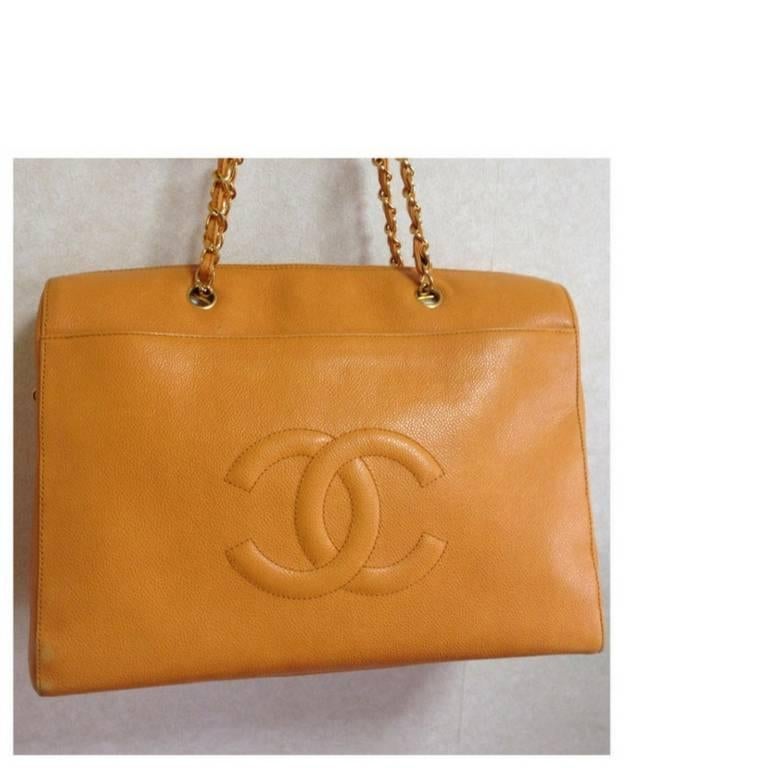 1990s. Vintage CHANEL orange yellow caviar leather chain shoulder large tote bag with golden chains and large CC stitch mark.
Lucky and good fortune color.

Here is your good fortune color, orange yellow caviar leather large tote bag from CHANEL.
A
