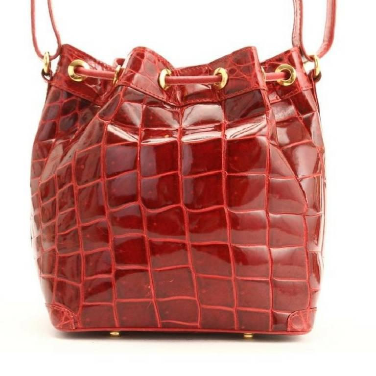 1990s. Vintage LANVIN genuine glossy red crocodile bucket, hobo shoulder bag with drawstrings. Rare masterpiece bag back in the era.

Introducing one of the rarest and most beautiful treasury masterpiece bags from LANVIN back in the 90's....a