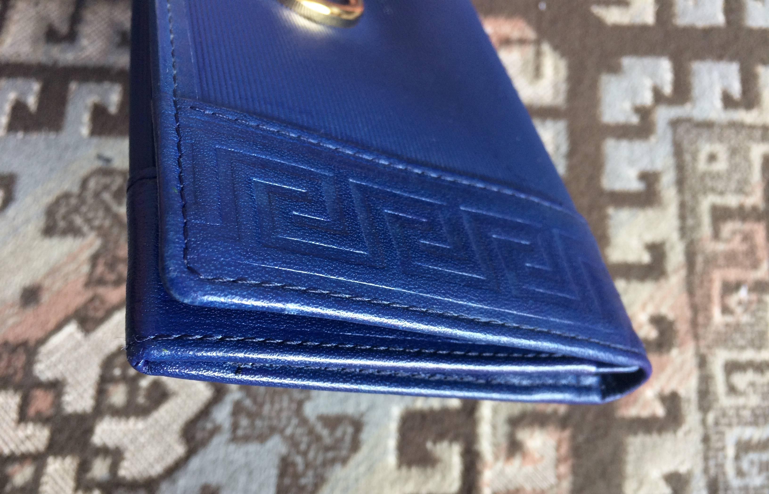 Vintage Gianni Versace blue wallet with geometric pattern and logo round motif. 1