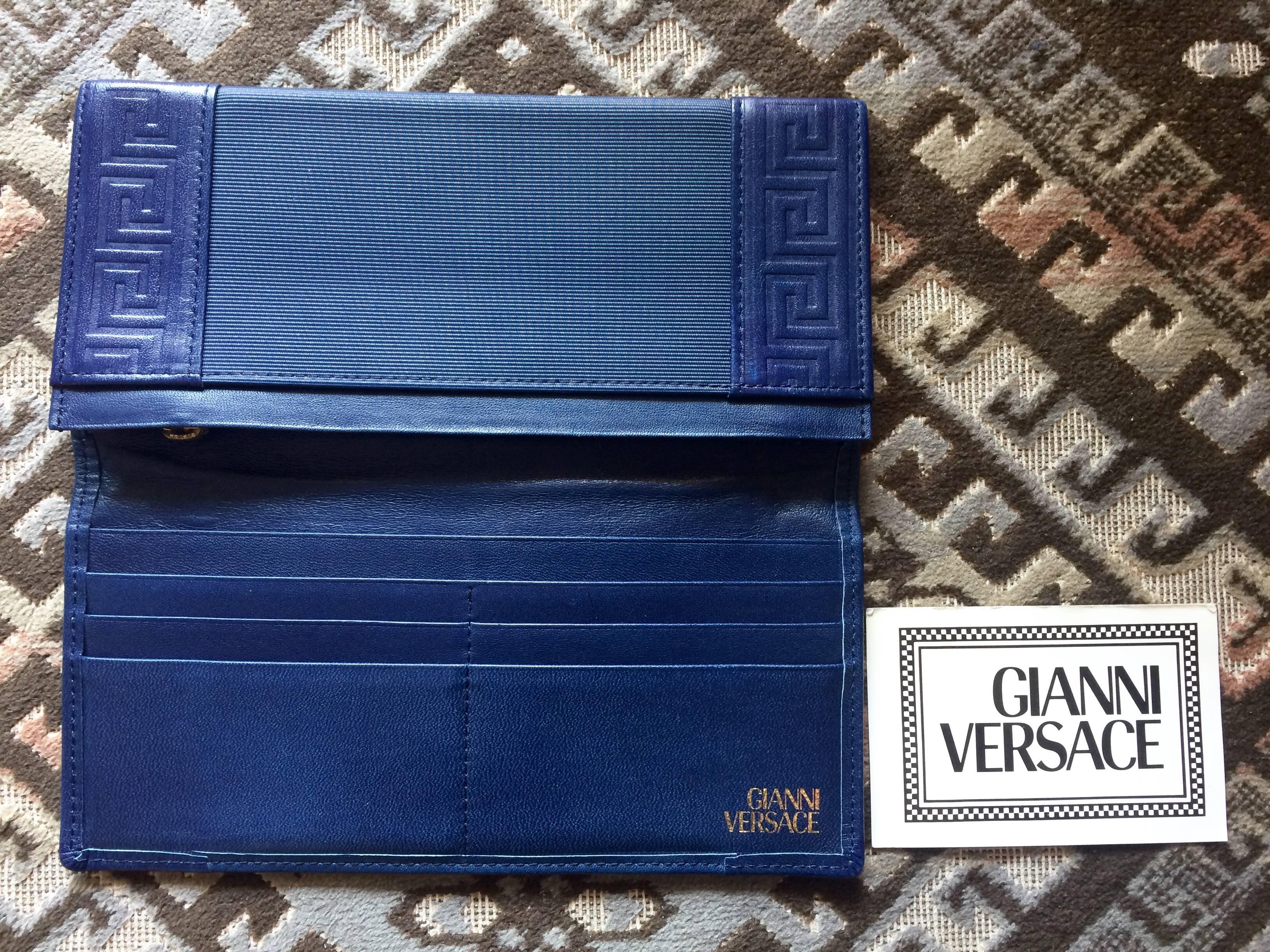 Vintage Gianni Versace blue wallet with geometric pattern and logo round motif. 2