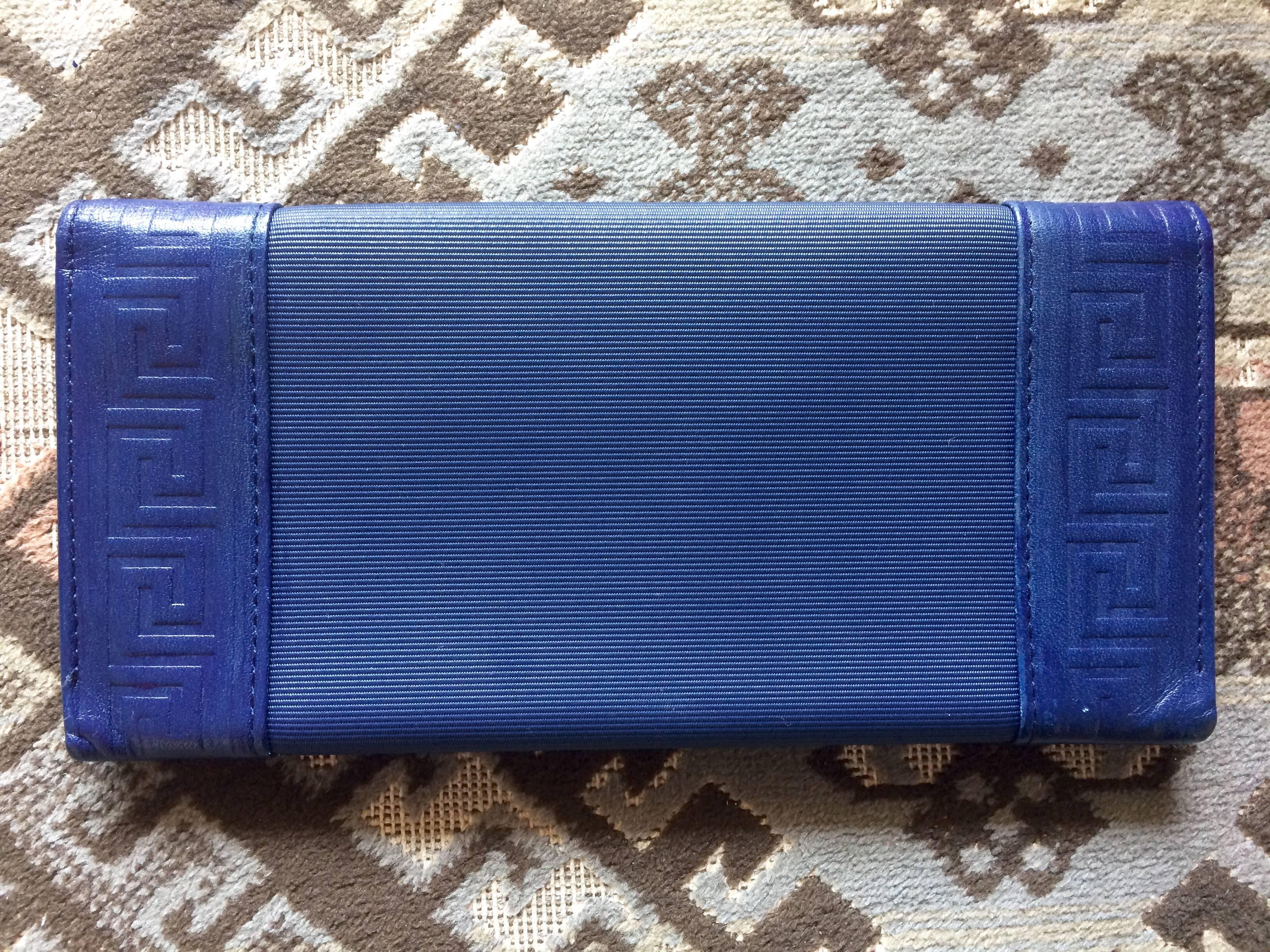 Women's or Men's Vintage Gianni Versace blue wallet with geometric pattern and logo round motif.