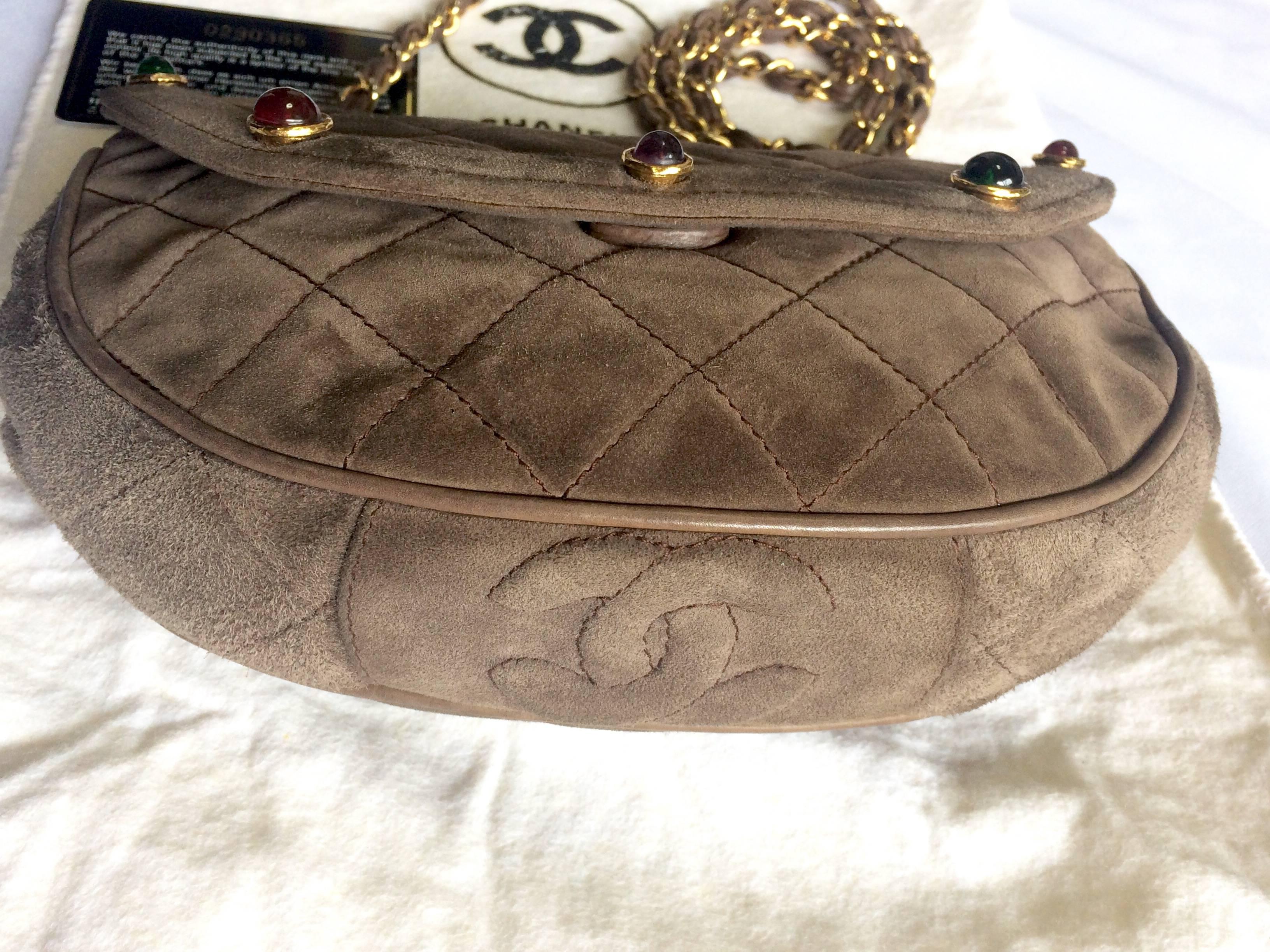 Brown Vintage CHANEL brown suede chain shoulder bag with gripoix stones and cc mark. For Sale