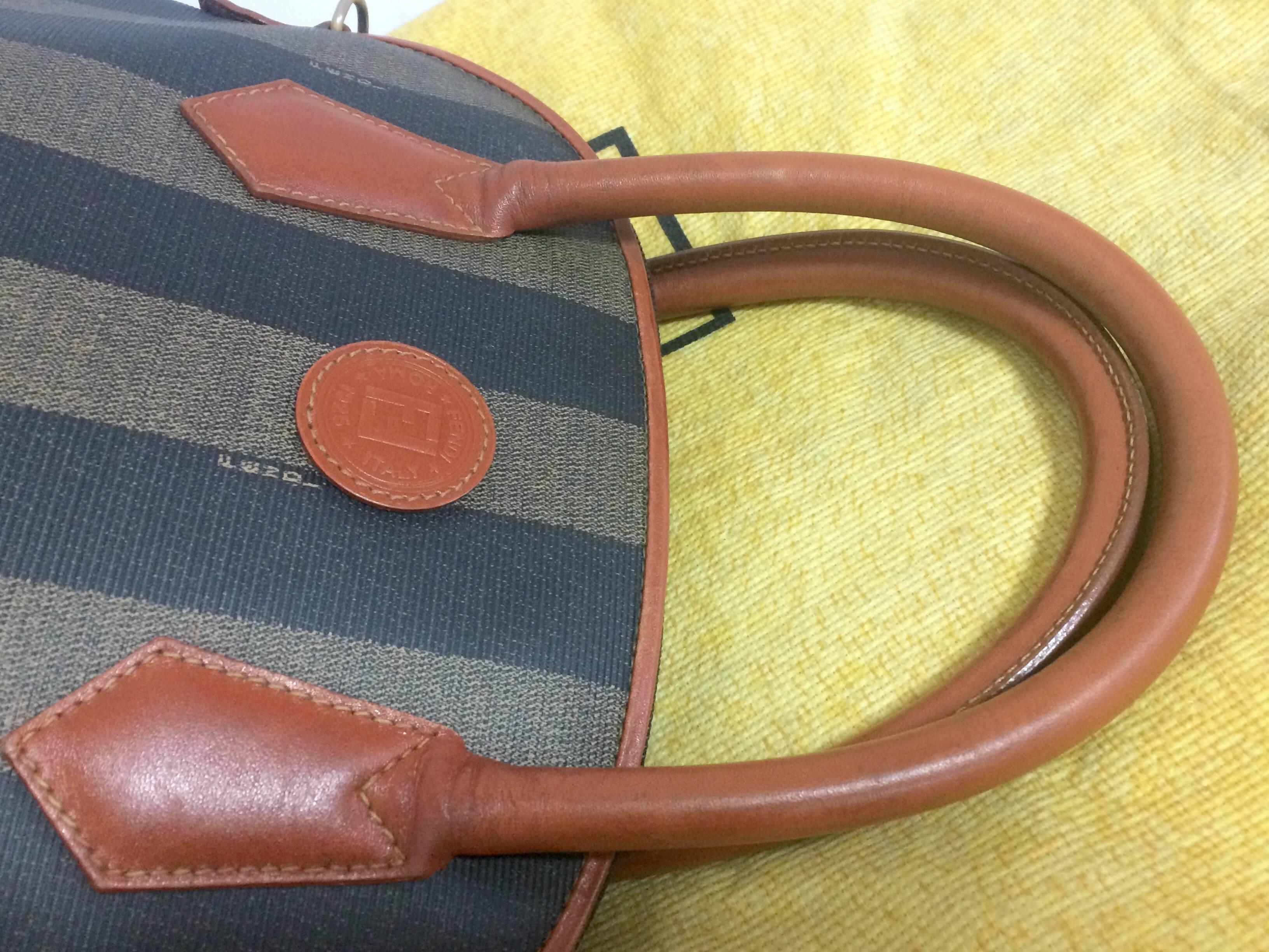 Women's Vintage FENDI pecan khaki and gray stripe bolide bag with brown leather handles.