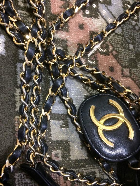 Vintage CHANEL black goatskin shoulder bag with gold tone chains and cc