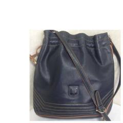 Vintage Celine navy and brown leather hobo bucket shoulder bag with drawstrings.