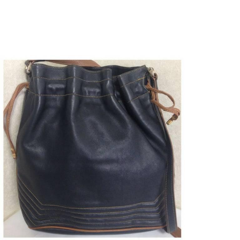 Black Vintage Celine navy and brown leather hobo bucket shoulder bag with drawstrings.