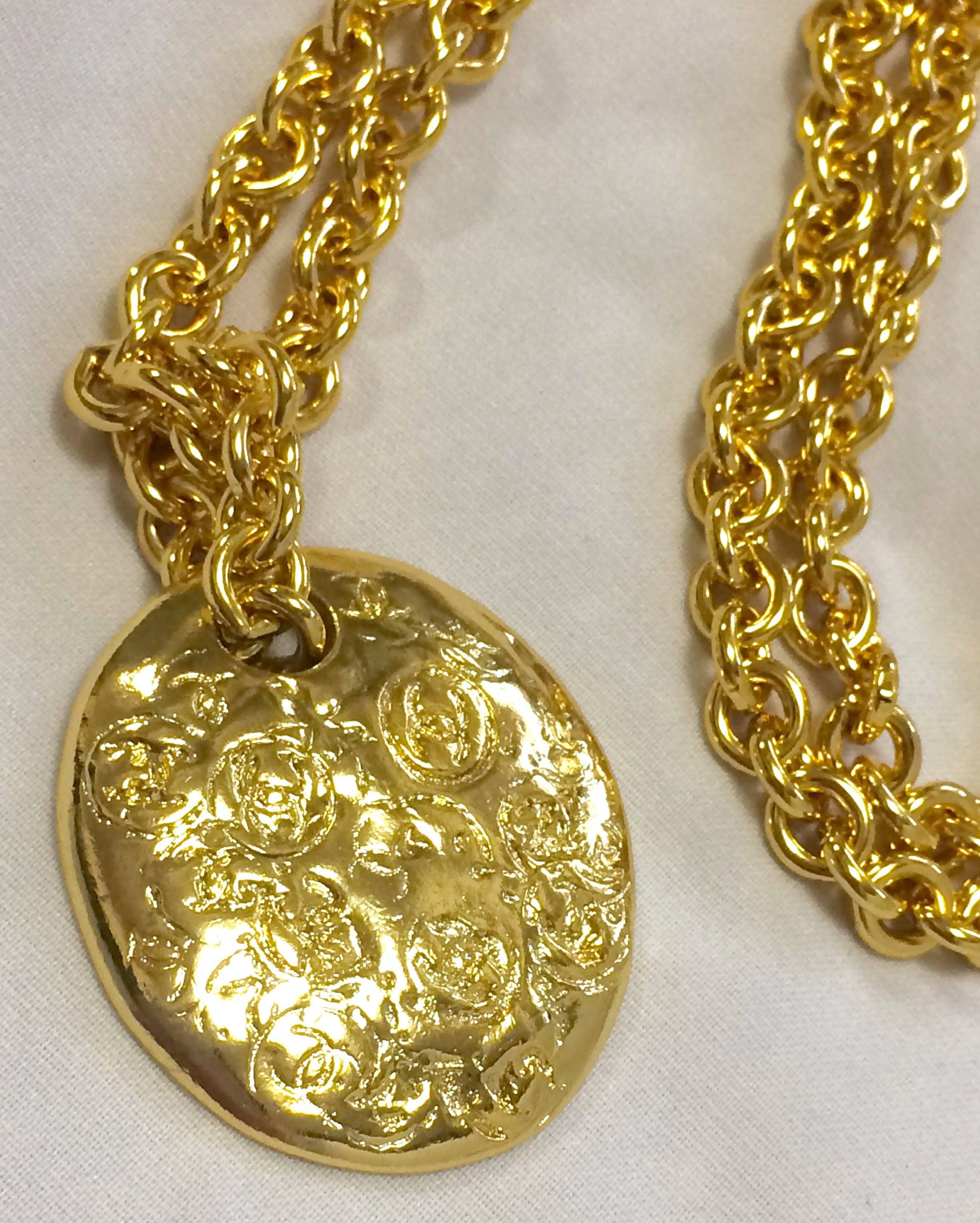 Women's MINT. Vintage CHANEL golden long chain necklace with round coin, medal shape top