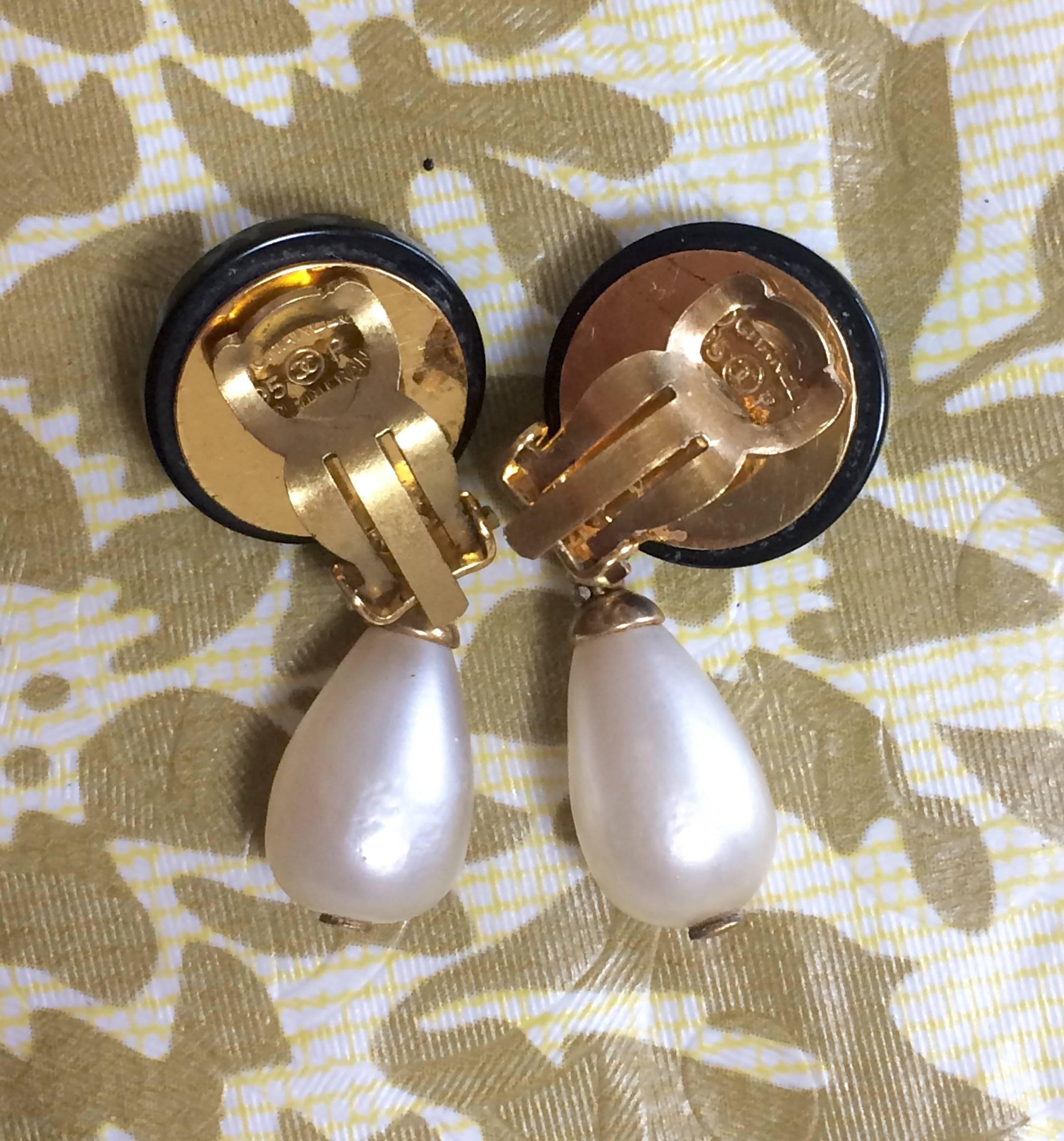Vintage CHANEL teardrop white faux pearl earrings with black and golden CC mark. For Sale 2