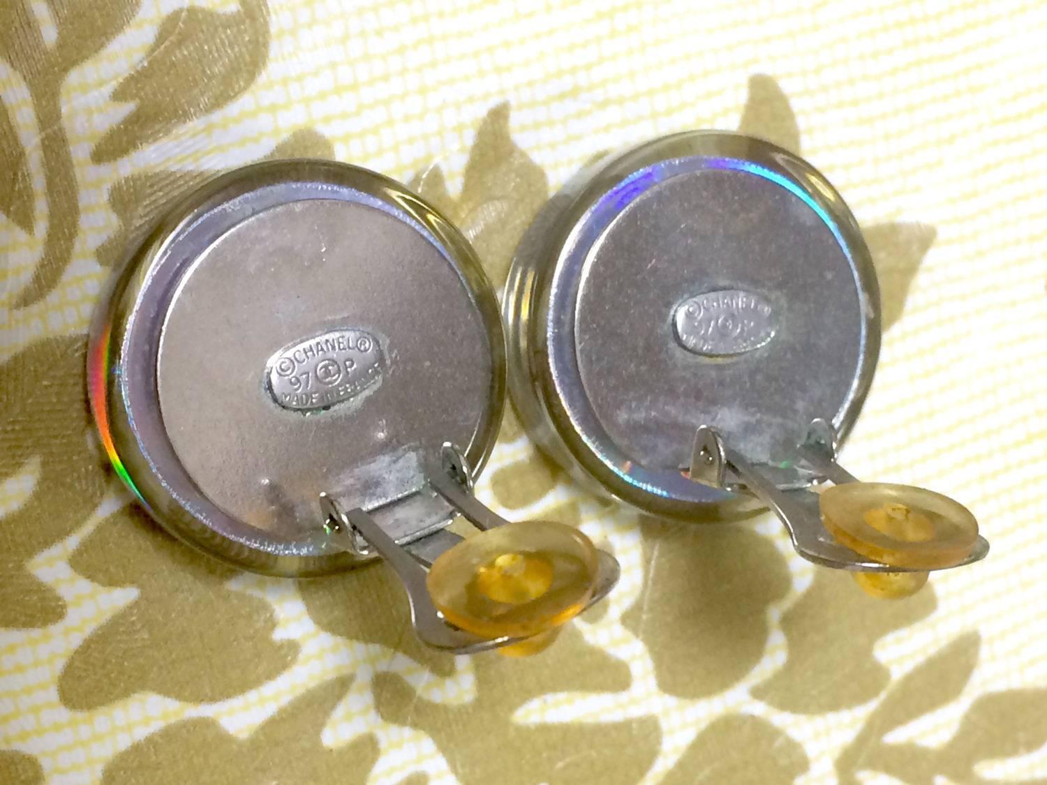 Vintage CHANEL silver tone and rainbow aurora shining earrings with motifs. For Sale 2
