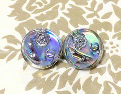 Vintage CHANEL silver tone and rainbow aurora shining earrings with motifs.