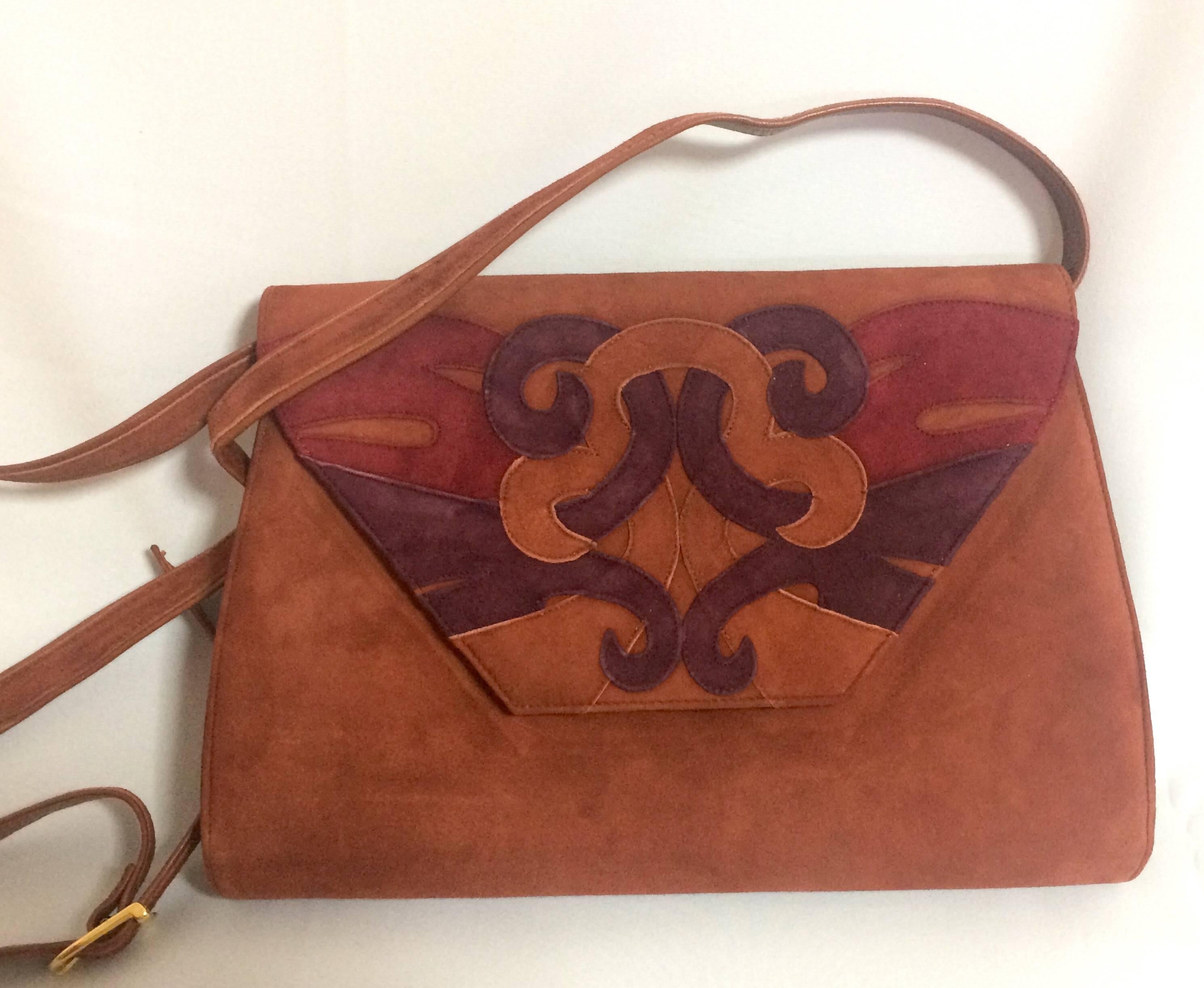 1980s. Vintage Bally brown, red, and purple suede leather ethnic design shoulder bag, clutch purse.

Introducing another fabulous vintage purse in brown, purple, and red suede leather.
Ethnic design from BALLY back in the 80's.
One of the rarest