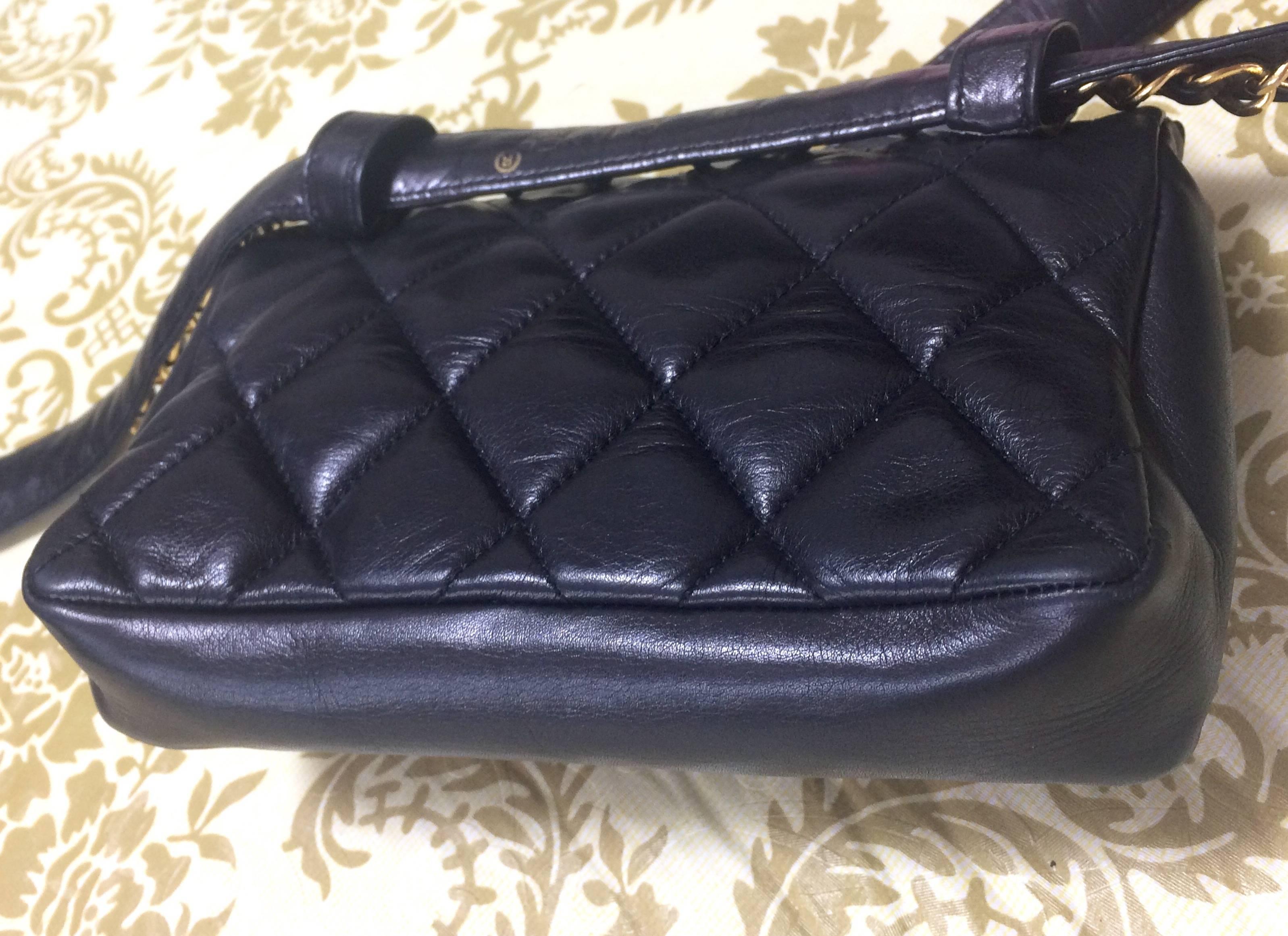 Women's Vintage CHANEL black leather waist bag, fanny pack with golden chain belt & CC.