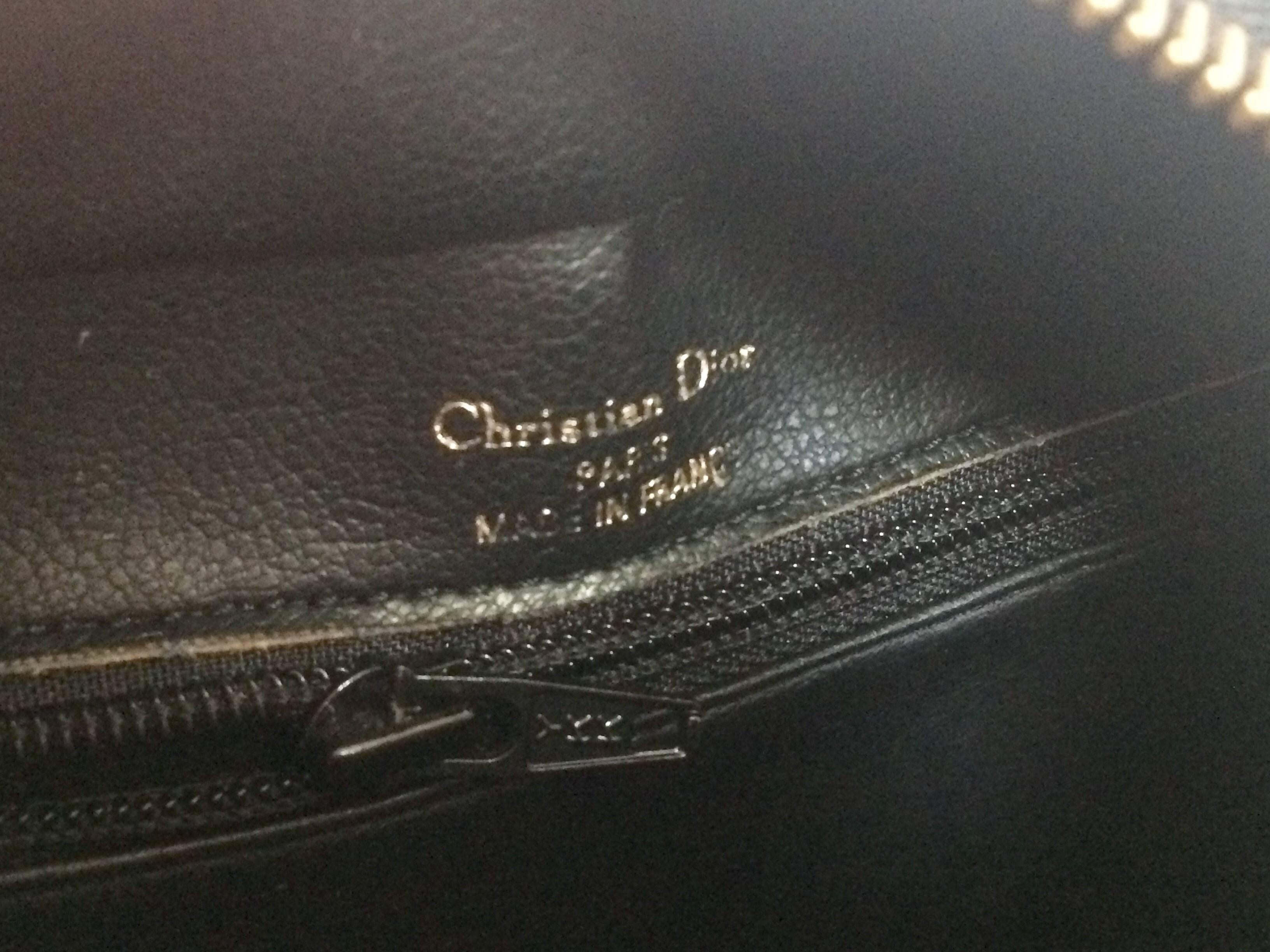 Vintage Christian Dior grained black leather handbag with oval golden CD logo.  For Sale 2
