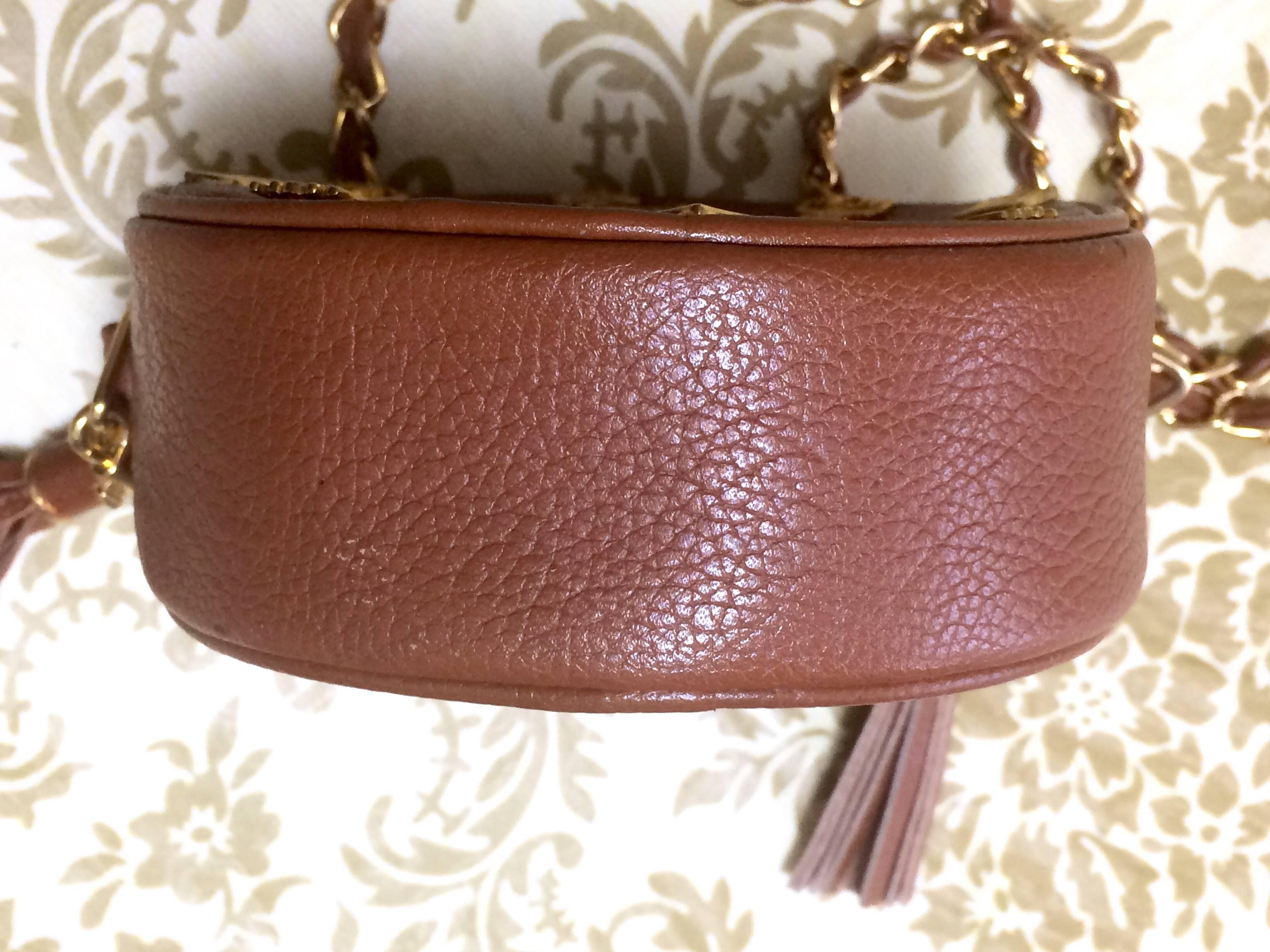 Brown Vintage MCM brown leather round  mini Suzy Wong shoulder bag with fringes. For Sale