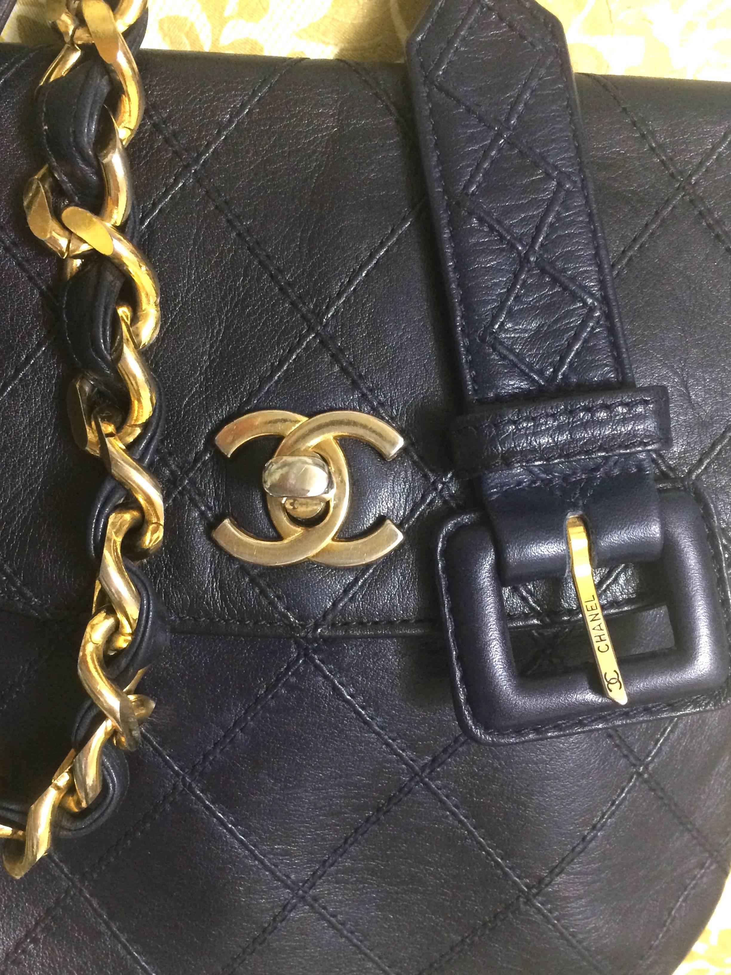Purple Vintage CHANEL dark navy leather waist purse, fanny pack with golden chain belt.
