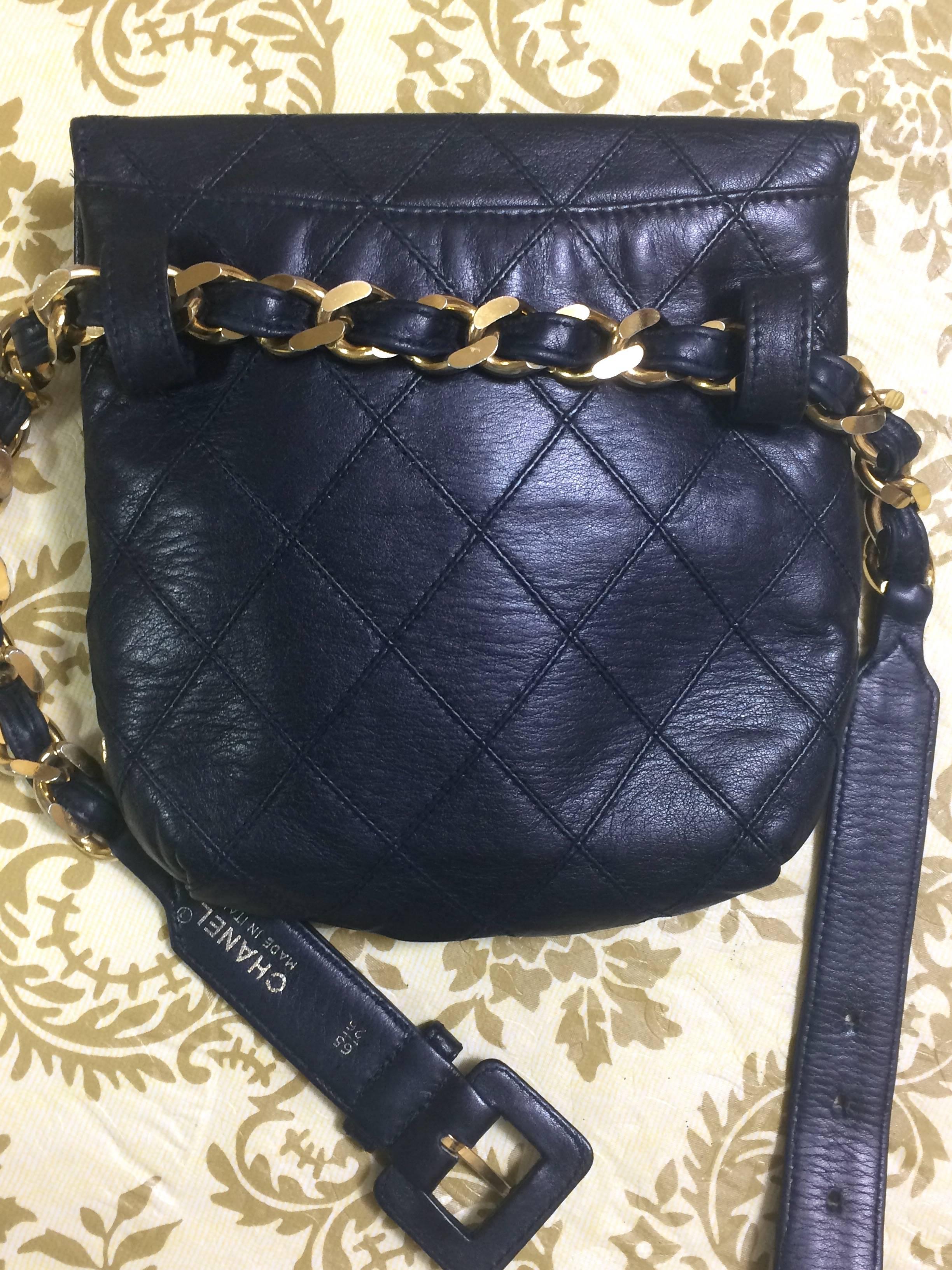 Women's Vintage CHANEL dark navy leather waist purse, fanny pack with golden chain belt.