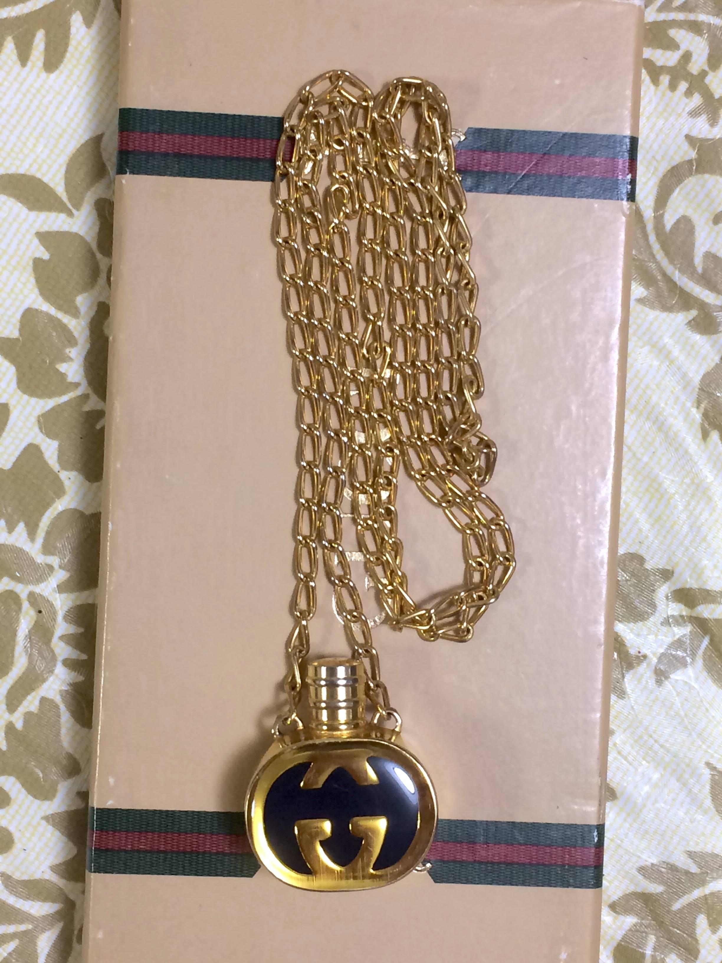 1980s. Vintage Gucci gold and navy round shape perfume bottle necklace with iconic logo mark. Perfect rare Gucci gift.

Beautiful vintage condition!

If you are looking for vintage Gucci necklace, then do not miss this opportunity!
Here is another