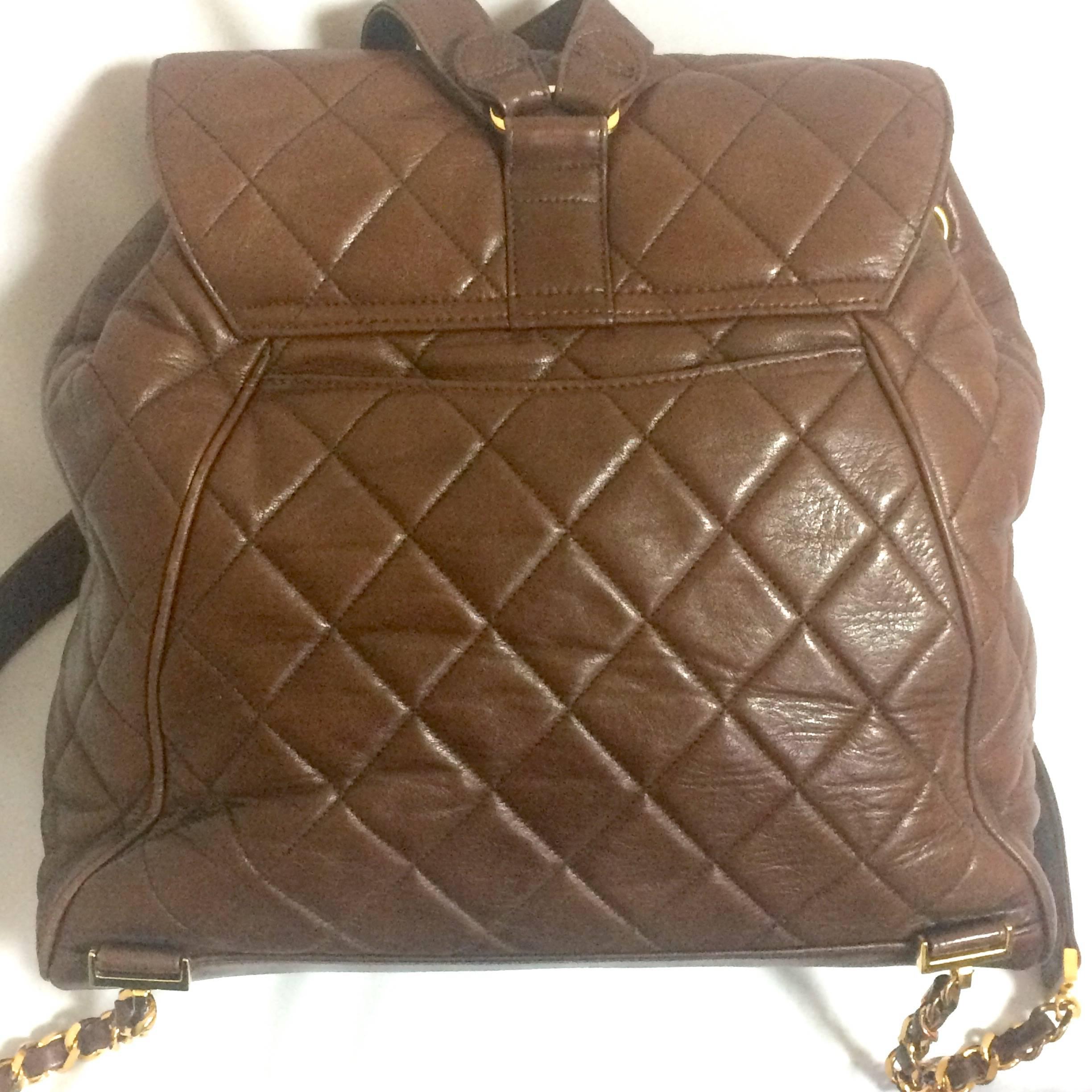 Brown Vintage CHANEL quilted brown lamb leather backpack with gold chain and large CC. For Sale