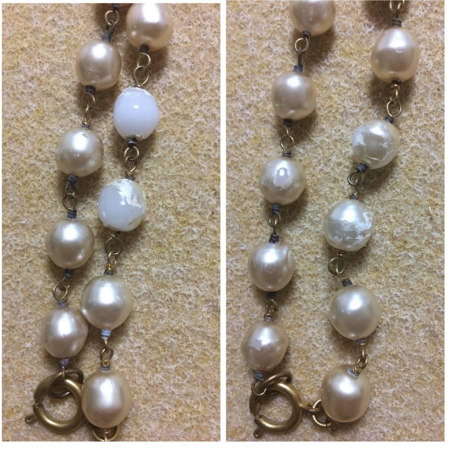 Vintage CHANEL white cream faux baroque pearl necklace with CC mark pendant top. 1