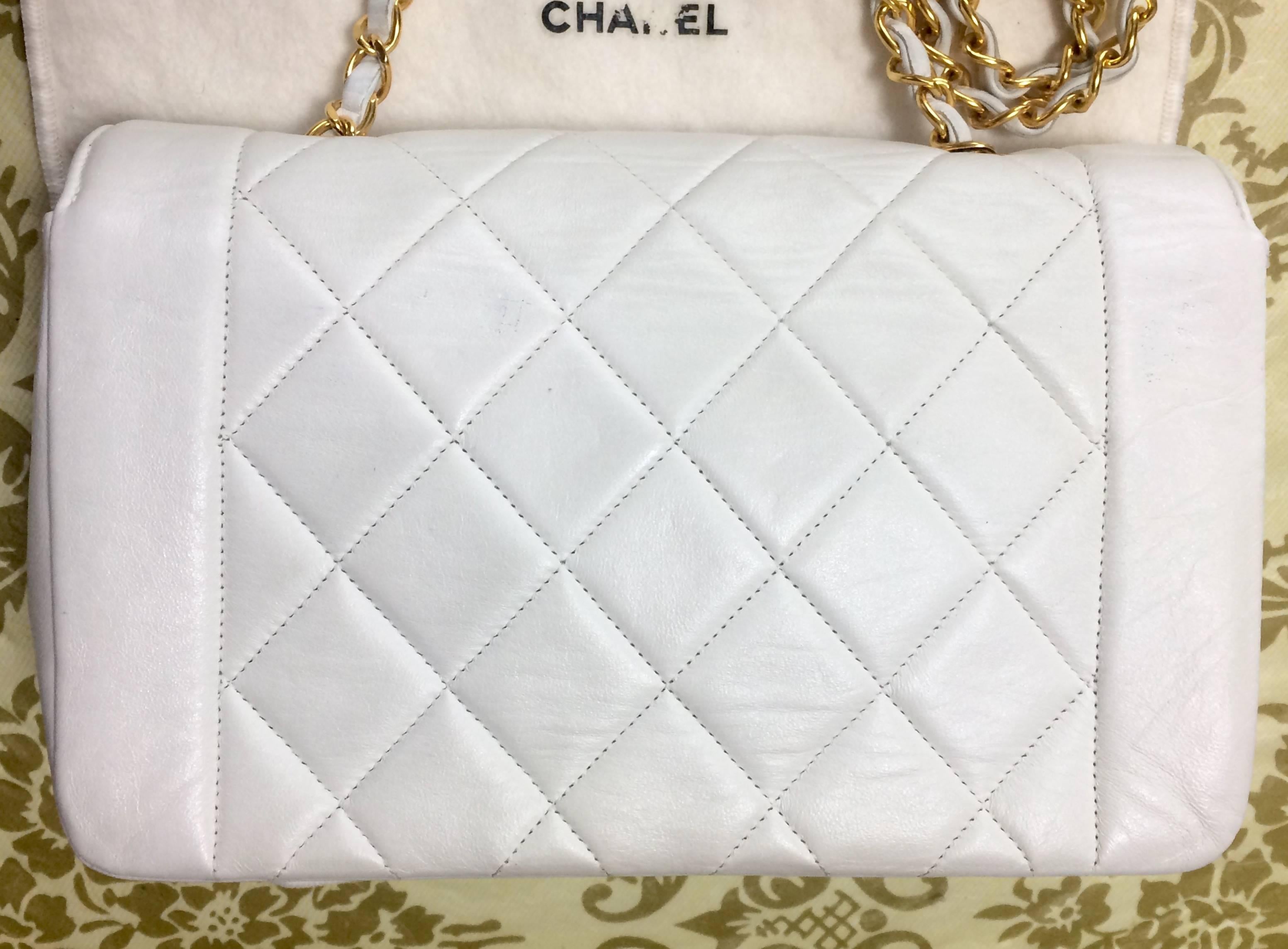 Beige Vintage Chanel classic 2.55 white color lamb leather shoulder bag with gold CC.