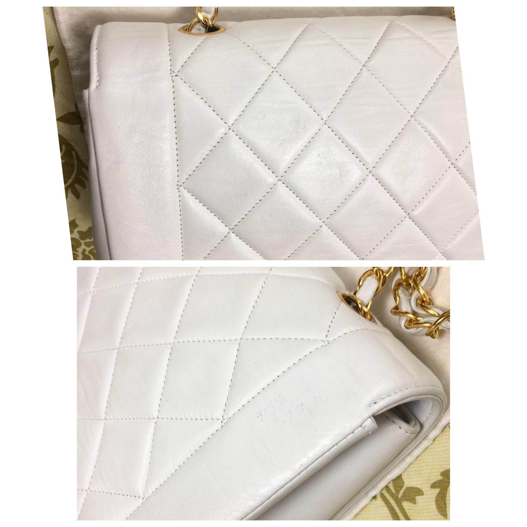 Women's Vintage Chanel classic 2.55 white color lamb leather shoulder bag with gold CC.