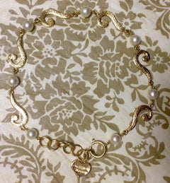 MINT. Vintage Moschino chain necklace with golden question marks and faux pearls