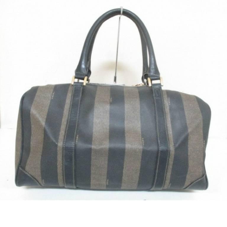 1990s. Vintage FENDI gray pecan stripe speedy style duffle bag, handbag purse with black leather trimmings. Fendi classic bag.

For all FENDI vintage lovers, this iconic stripe pattern purse is here for you!
Classic piece in black and gray color