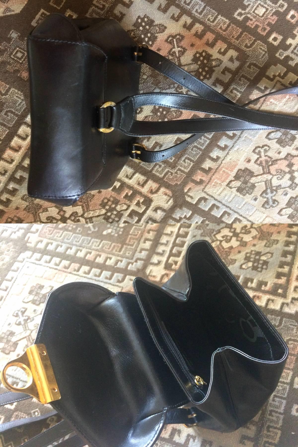 Vintage Salvatore Ferragamo black calf leather backpack with golden motif 3