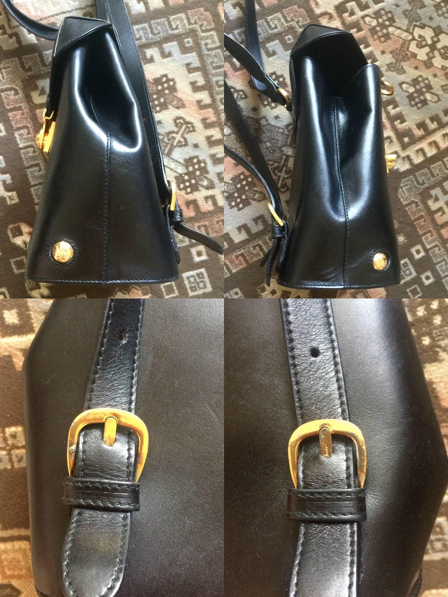 Vintage Salvatore Ferragamo black calf leather backpack with golden motif 2