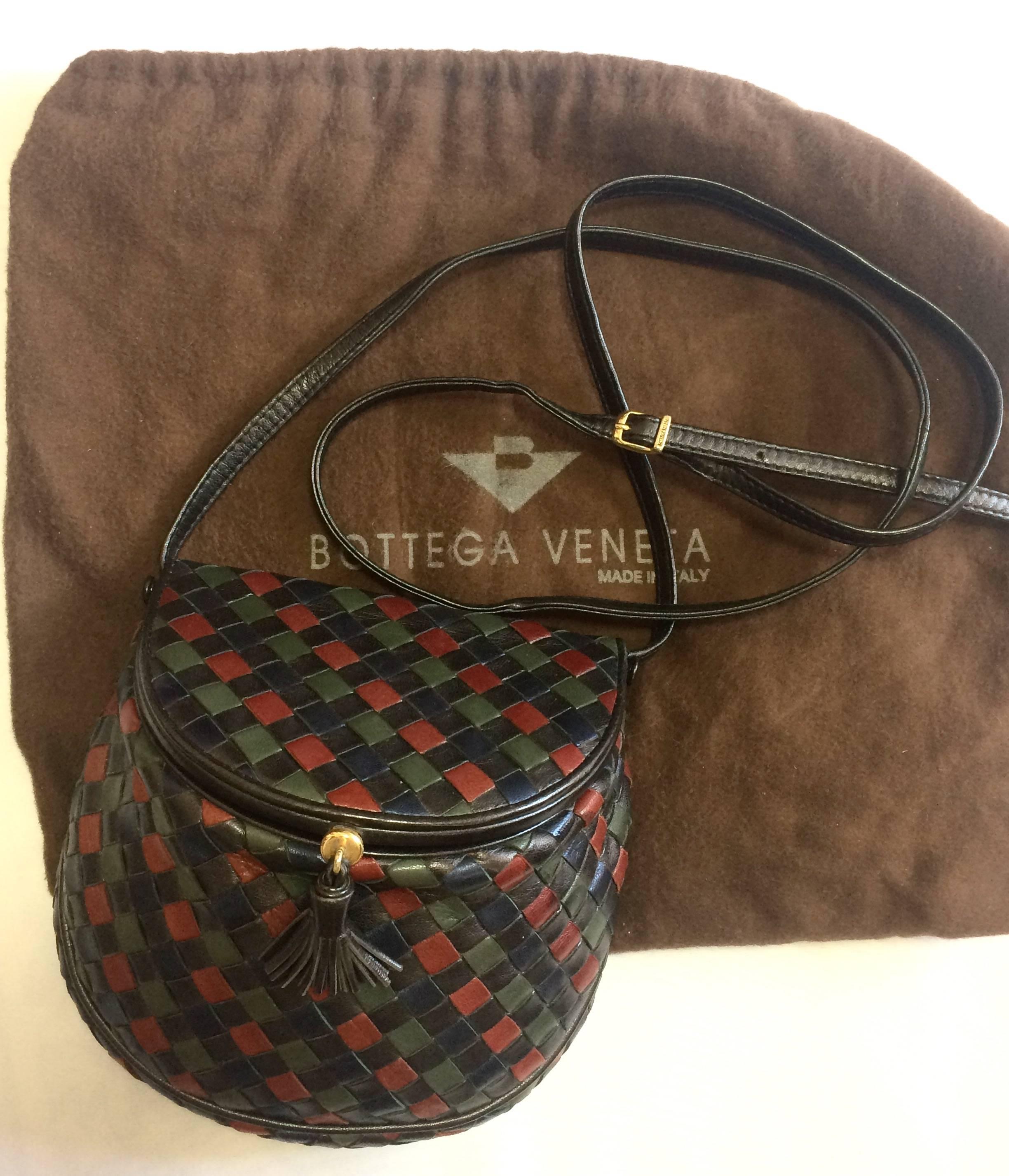 1990s. Vintage Bottega Veneta navy, khaki, wine, brown, and black fisherman style intrecciato shoulder bag with a fringe. Must have unique bag.

Beautiful vintage condition! Must have unique Bottega purse back in the era...

Introducing another