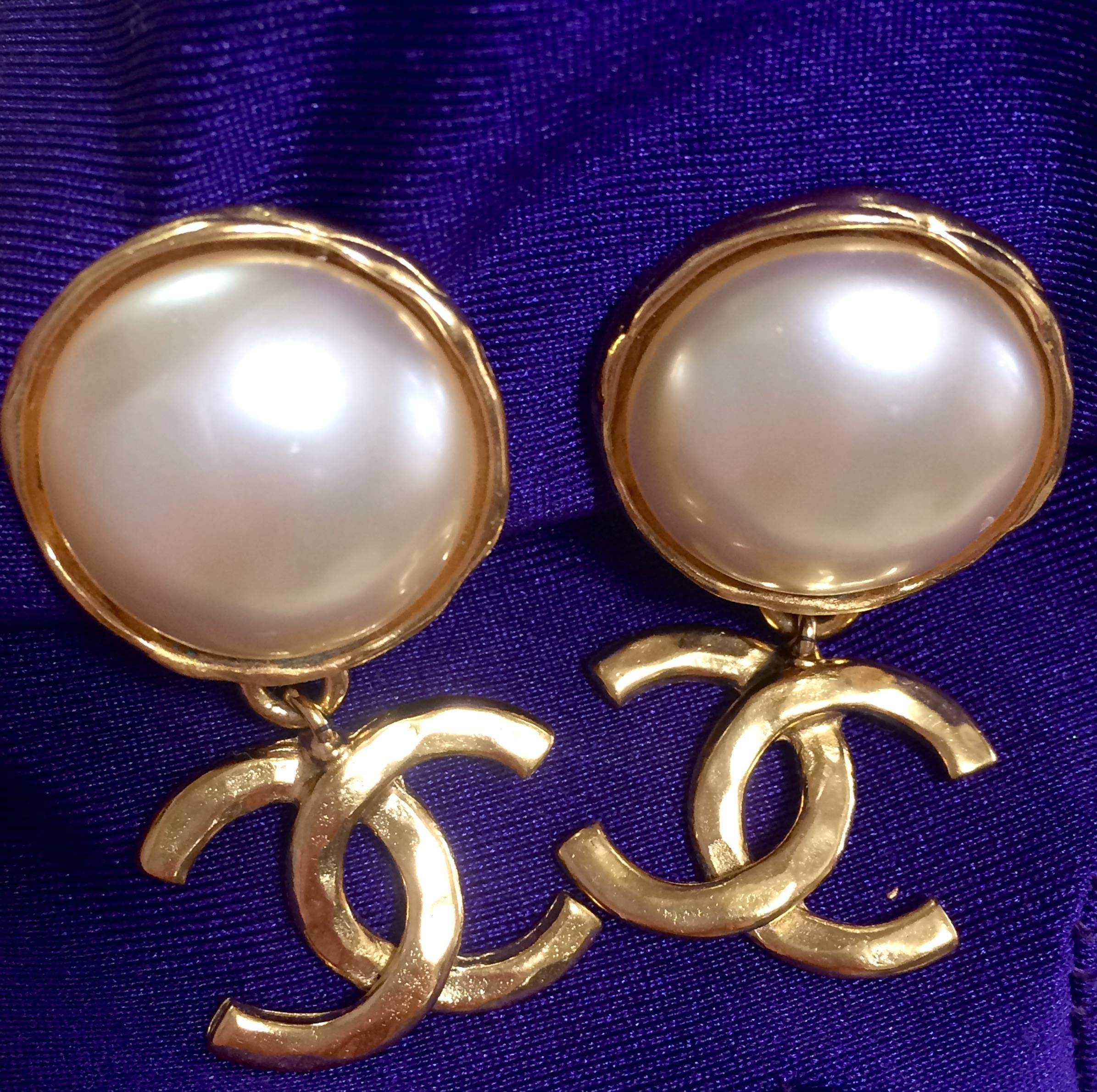 Vintage CHANEL classic round white faux pearl and golden CC dangling earrings.  2