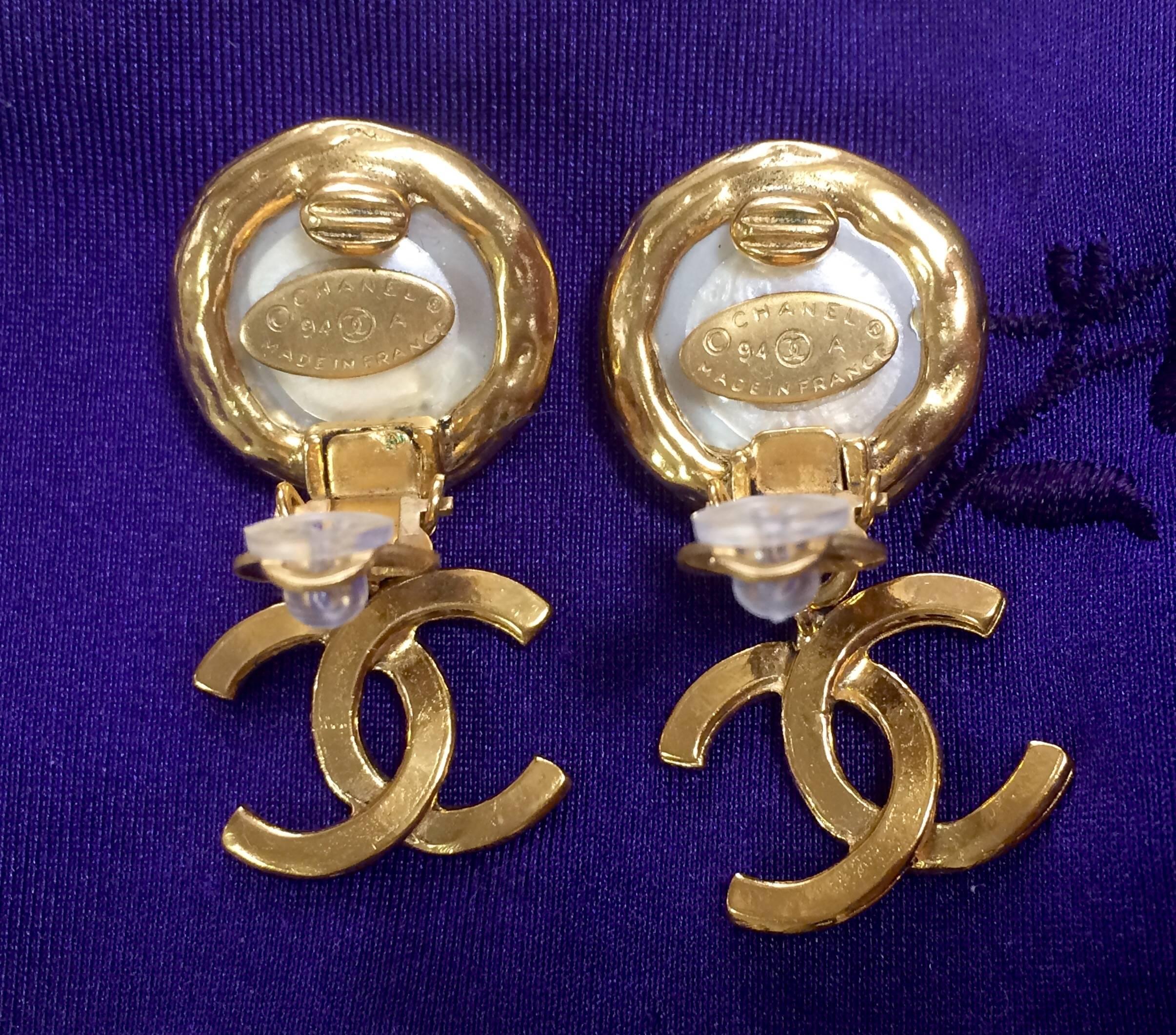 Vintage CHANEL classic round white faux pearl and golden CC dangling earrings.  3