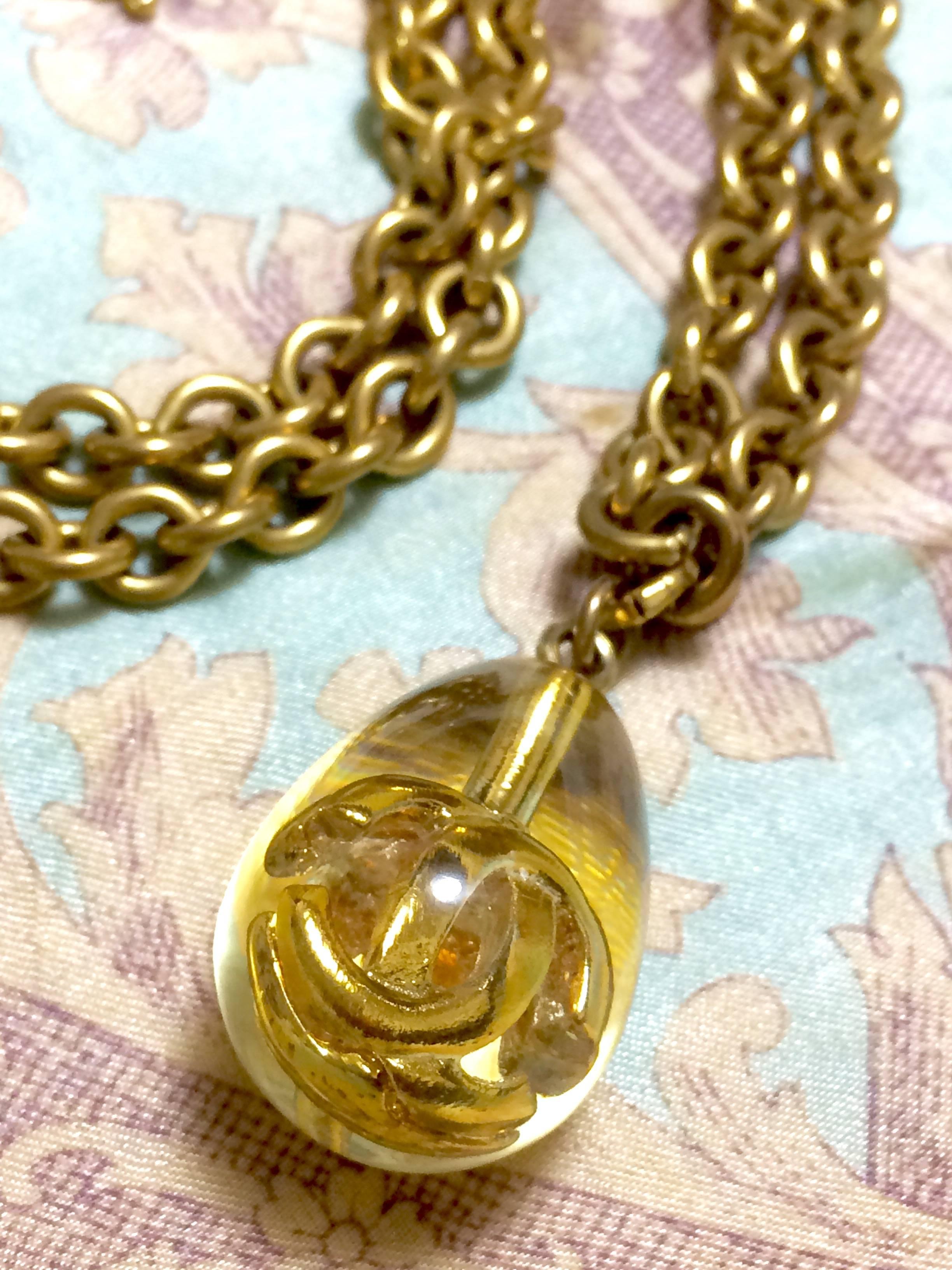 Women's Vintage CHANEL long chain necklace with clear and gold teardrop CC pendant top. For Sale