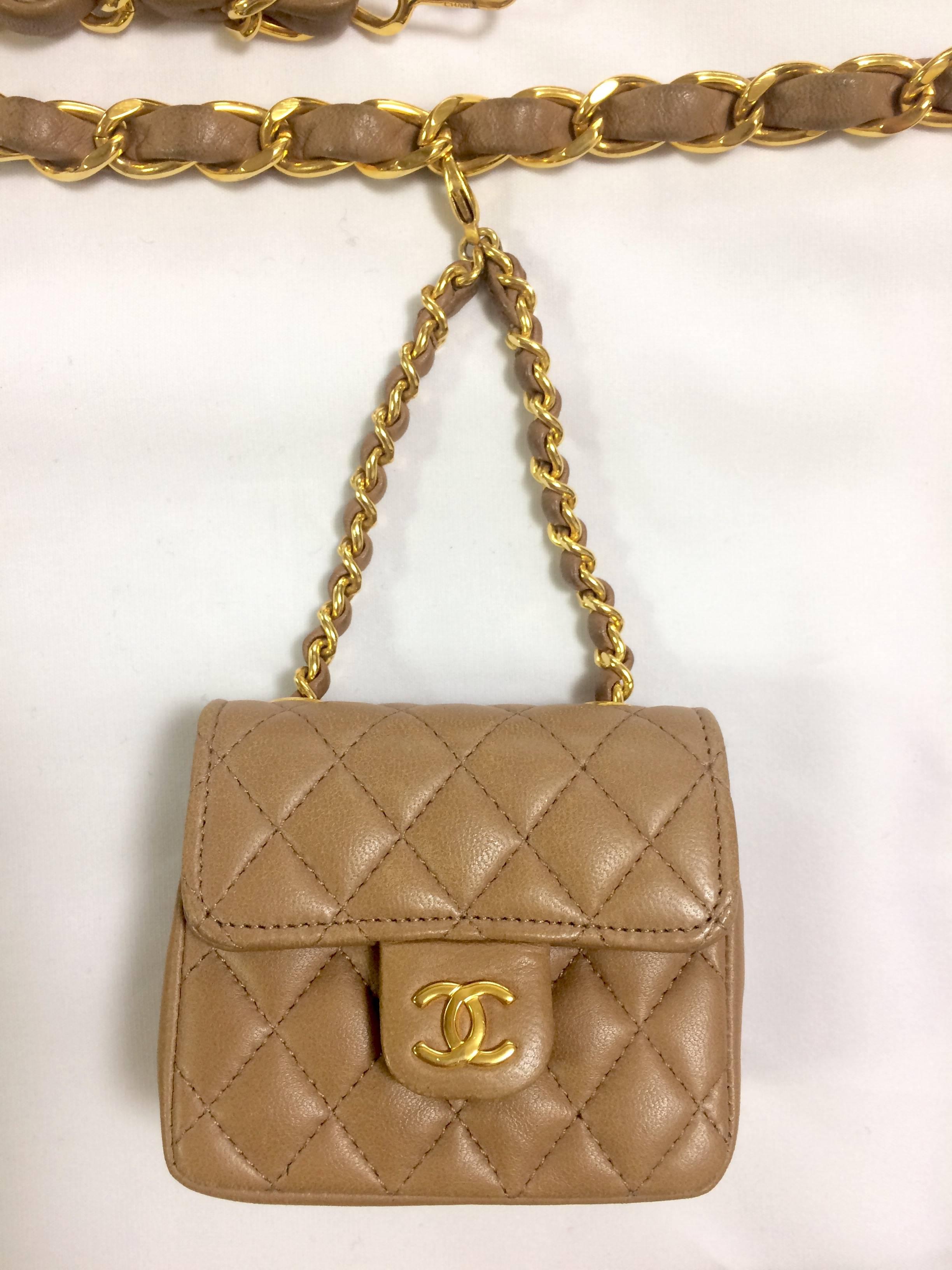 1990s. Vintage CHANEL brown lambskin mini 2.55 bag charm chain leather belt with golden CC charm. Must have.

Here is another fabulous piece from CHANEL back in the era of 80's - 90's, a brown leather golden chain belt with its iconic mini 2.55 bag