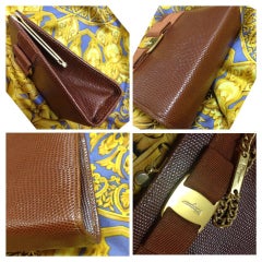 Vintage Salvatore Ferragamo brown lizard embossed leather golden chain clutch.
